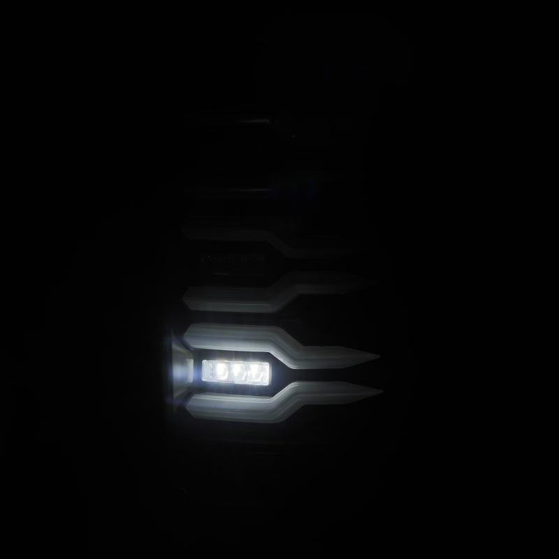 AlphaRex Luxx-Series LED tail lights for 07-13 GMC Sierra 1500 and 07-14 2500/3500HD, featuring a sleek black design.