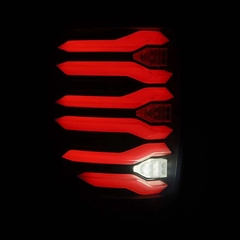 AlphaRex LUXX LED taillights for 09-14 Ford F150 featuring black housing and a striking red light design.