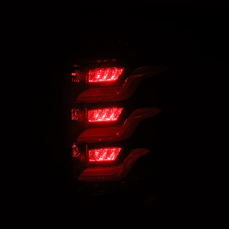 AlphaRex PRO-Series LED tail lights for 11-15 Ford Explorer in jet black, featuring a sleek design and bright red illumination.