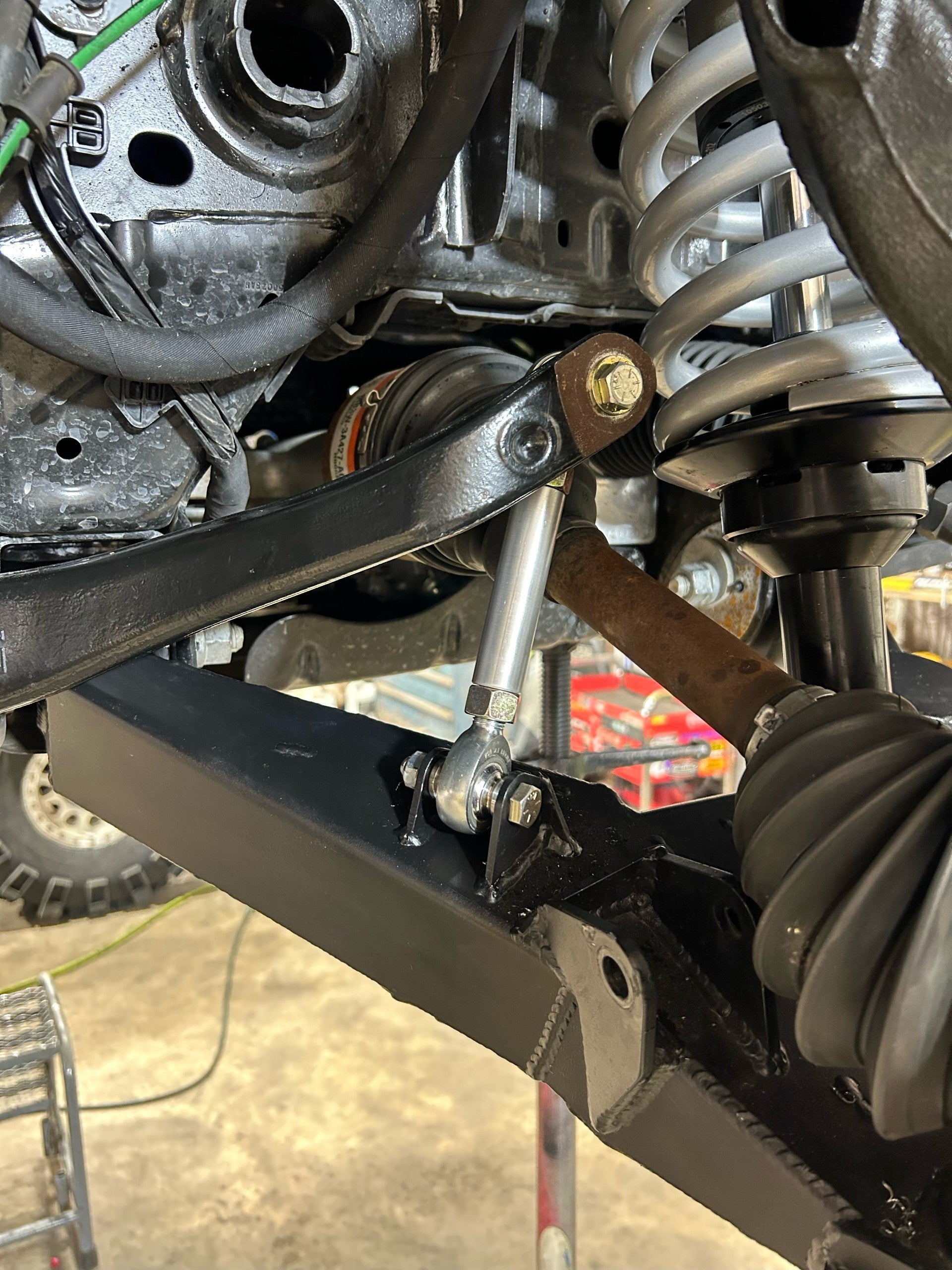 Bronco 2021+ sway bar links installed on stock sway bar and fabricated A-arms, showcasing offroad suspension components.