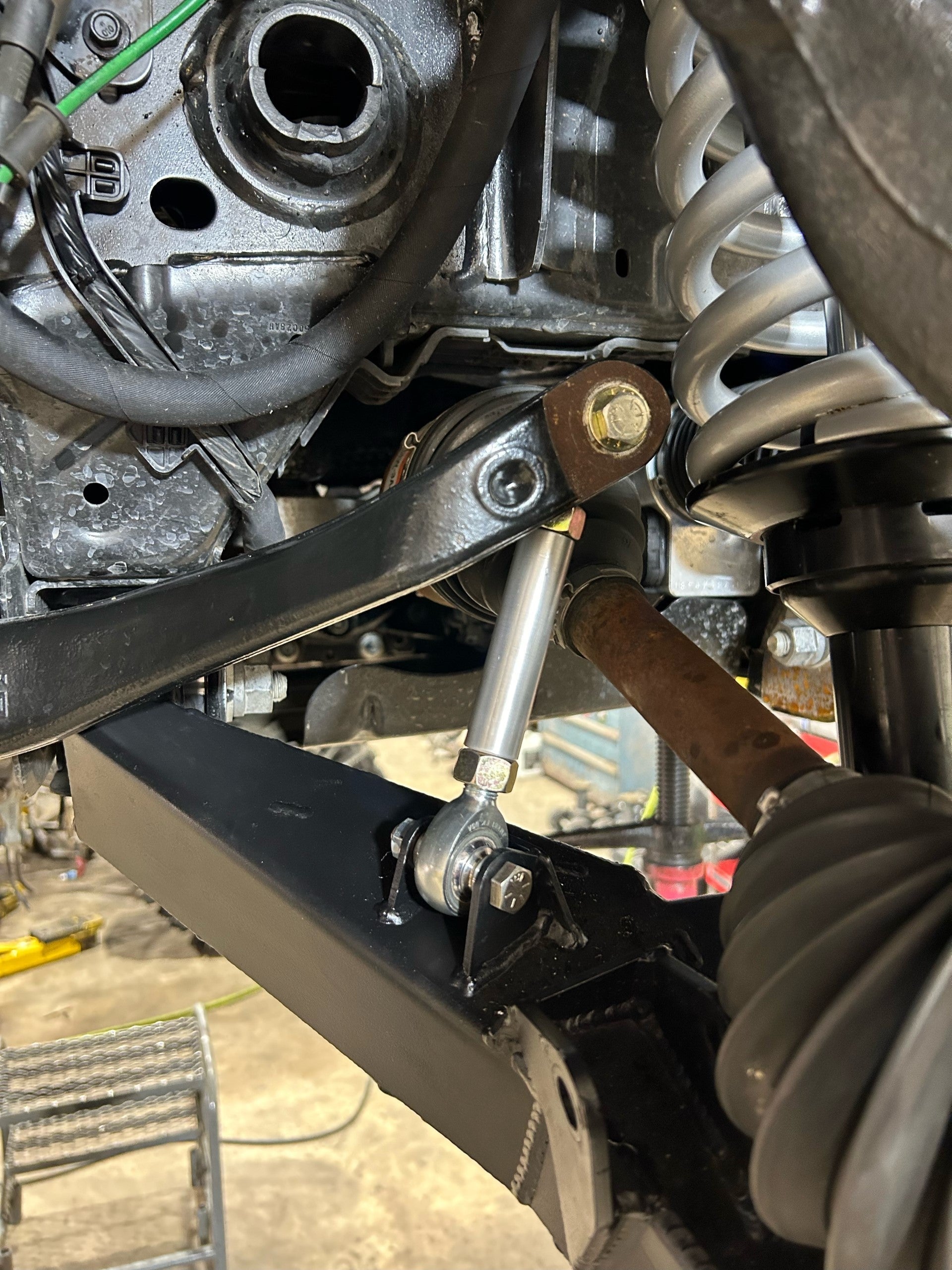 Bronco 2021+ sway bar links installed on stock sway bar and fabricated A-arms, showcasing offroad suspension components.