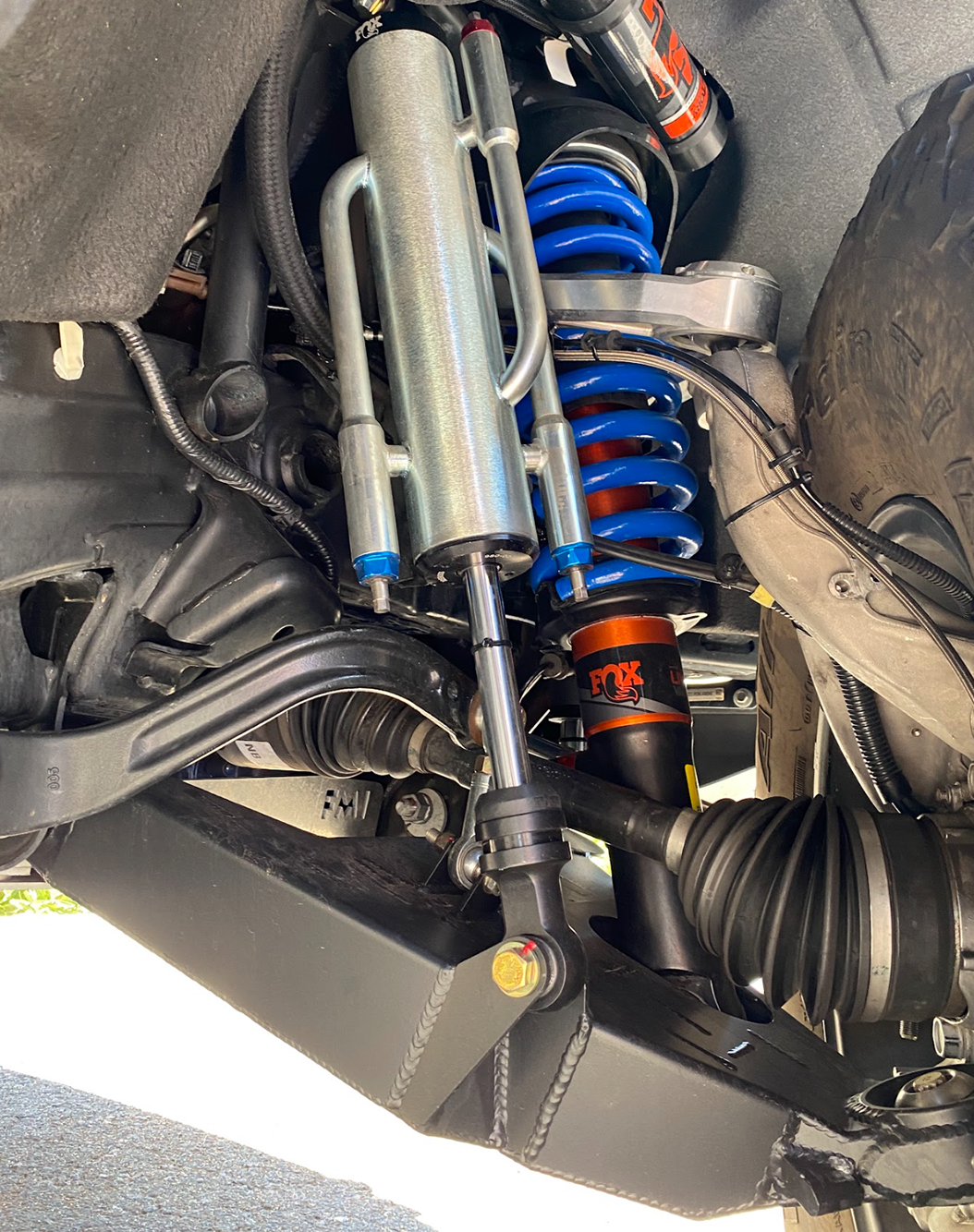 2022 Bronco Raptor mid travel front suspension kit showcasing shock absorbers and coil springs for enhanced off-road performance.