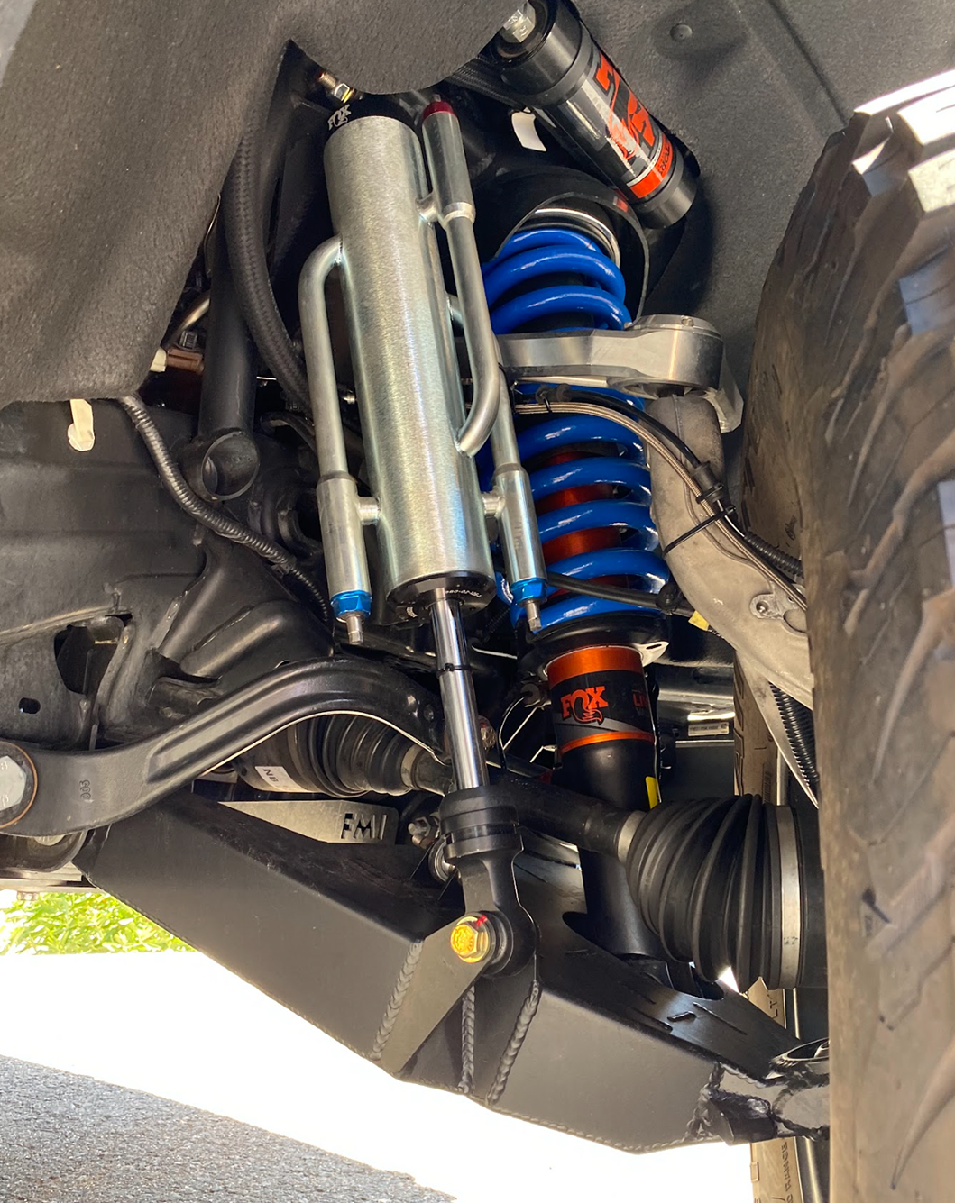 Mid travel front suspension kit for 2022+ Bronco Raptor, showcasing advanced shock absorbers and coil springs.