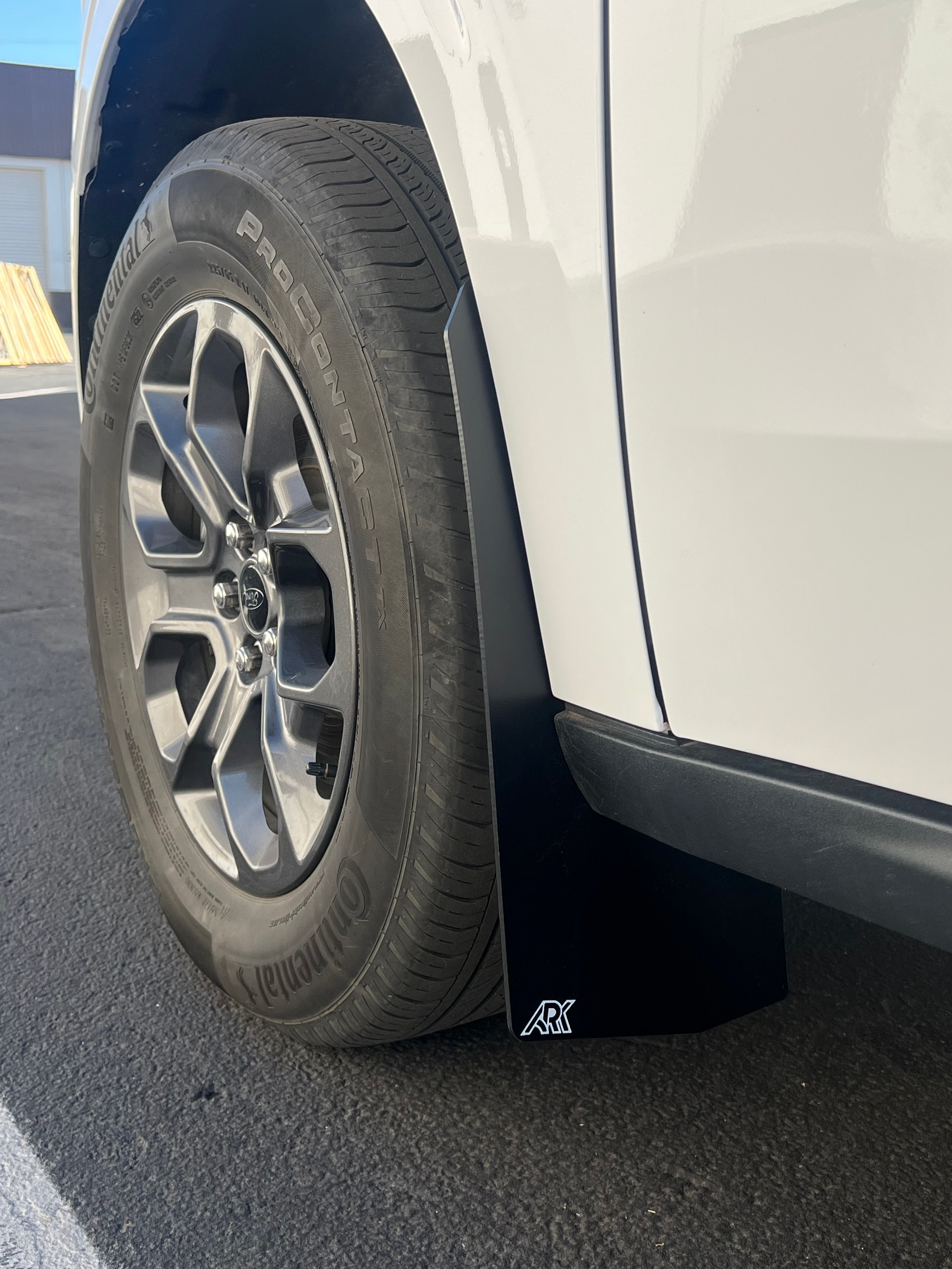 2022+ Ford Maverick mud flaps installed on a vehicle, showcasing durable design and tire protection.