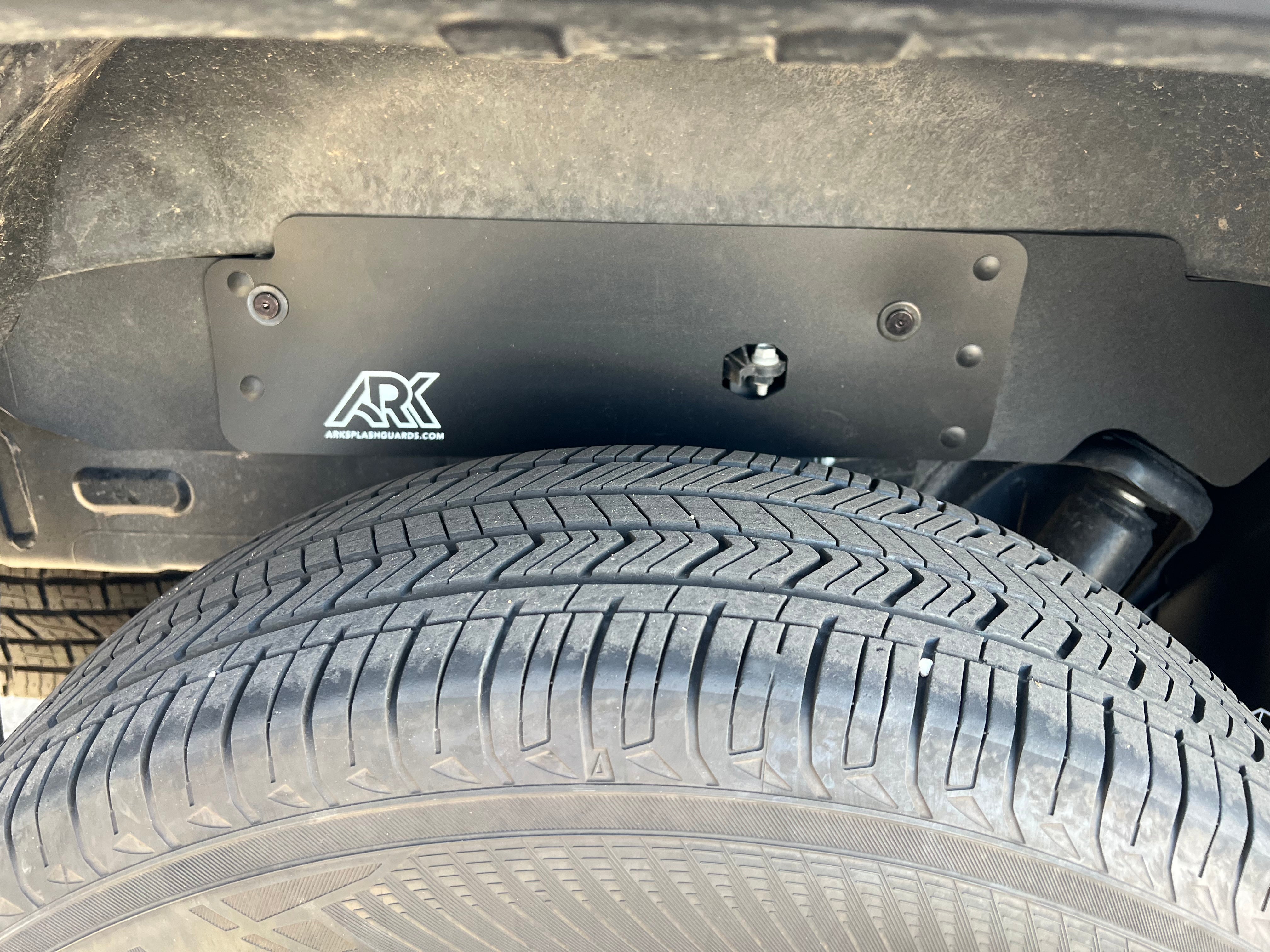 2022+ Toyota Tundra TriXPoly rear splash guards installed behind a tire, providing protection from mud and debris.