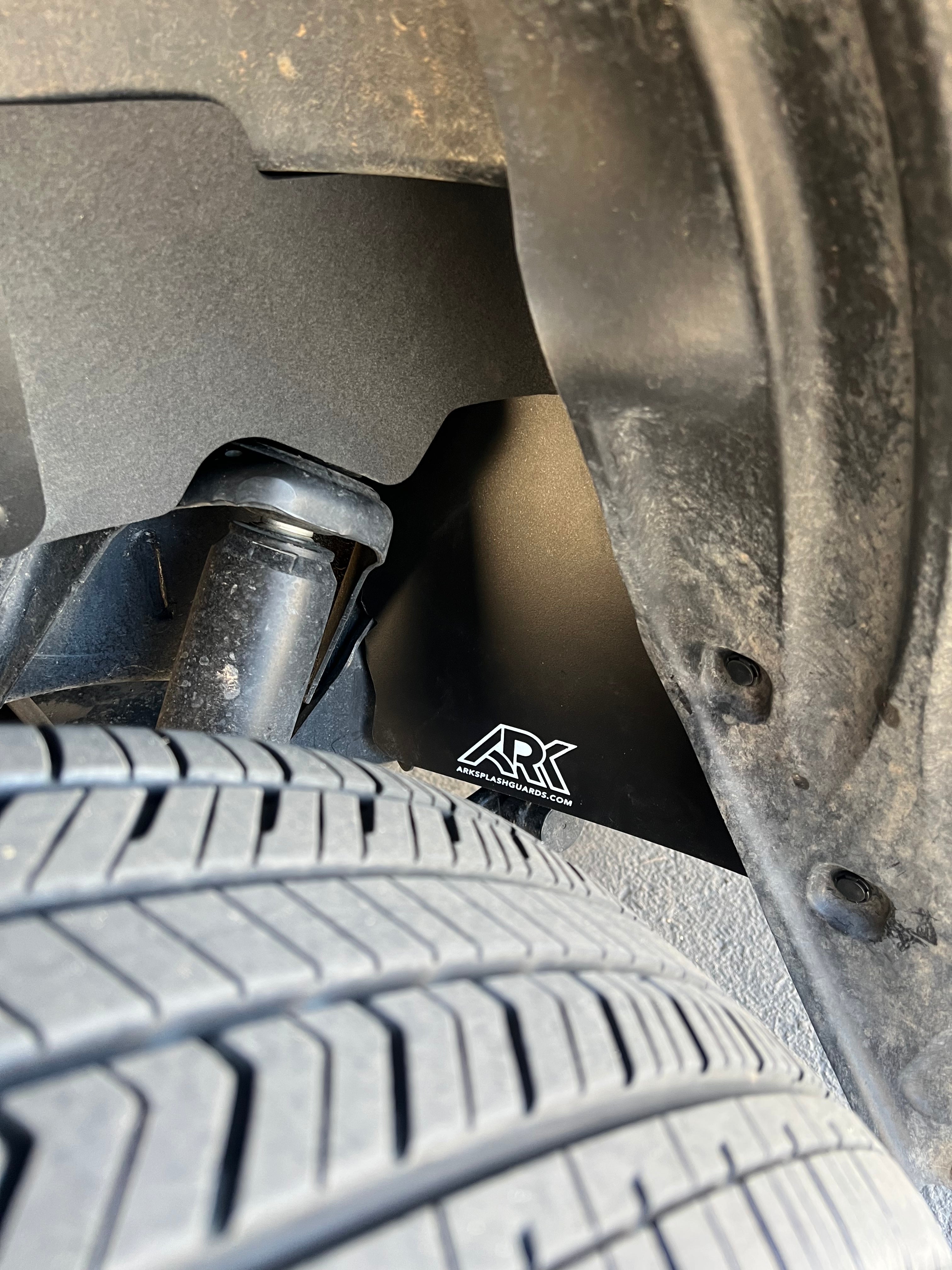 2022+ Toyota Tundra TriXPoly fuel line protection panel installed near the tire, showcasing durability and design.