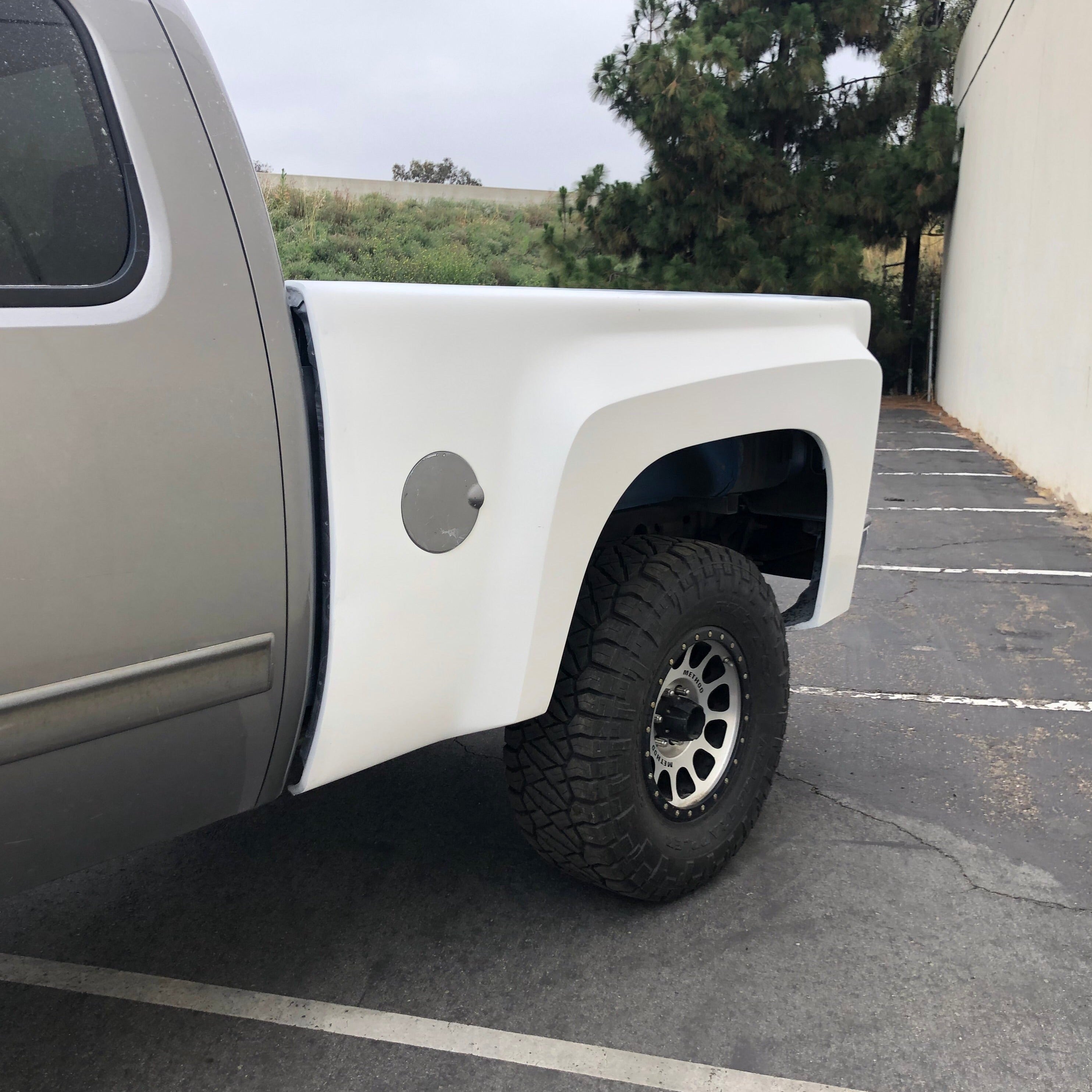2007-2013 Chevrolet Silverado bedsides displayed on a truck, showcasing a rugged offroad design and sturdy construction.