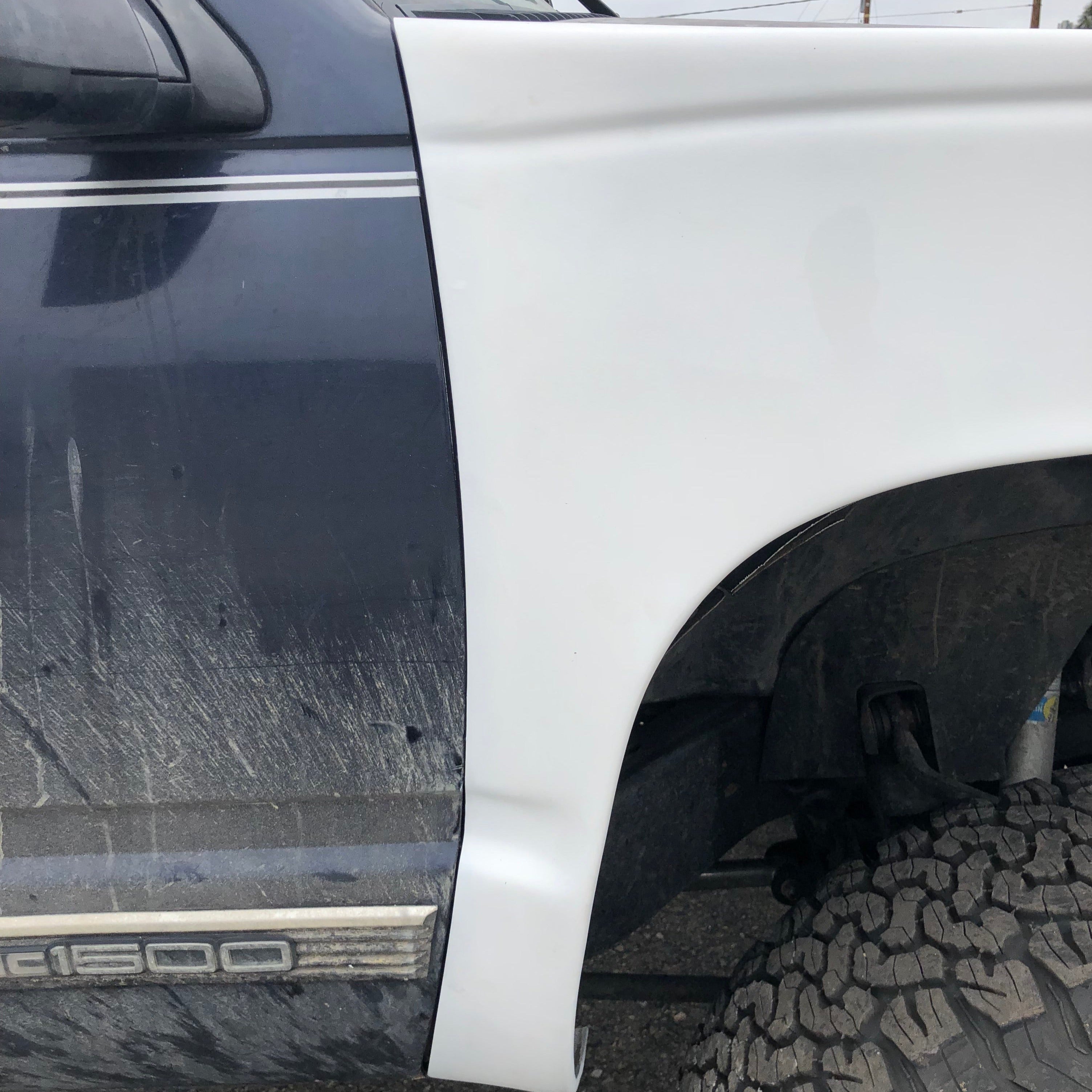 1988-1998 Chevrolet Silverado fender showcasing a clean, white finish for truck restoration and customization.