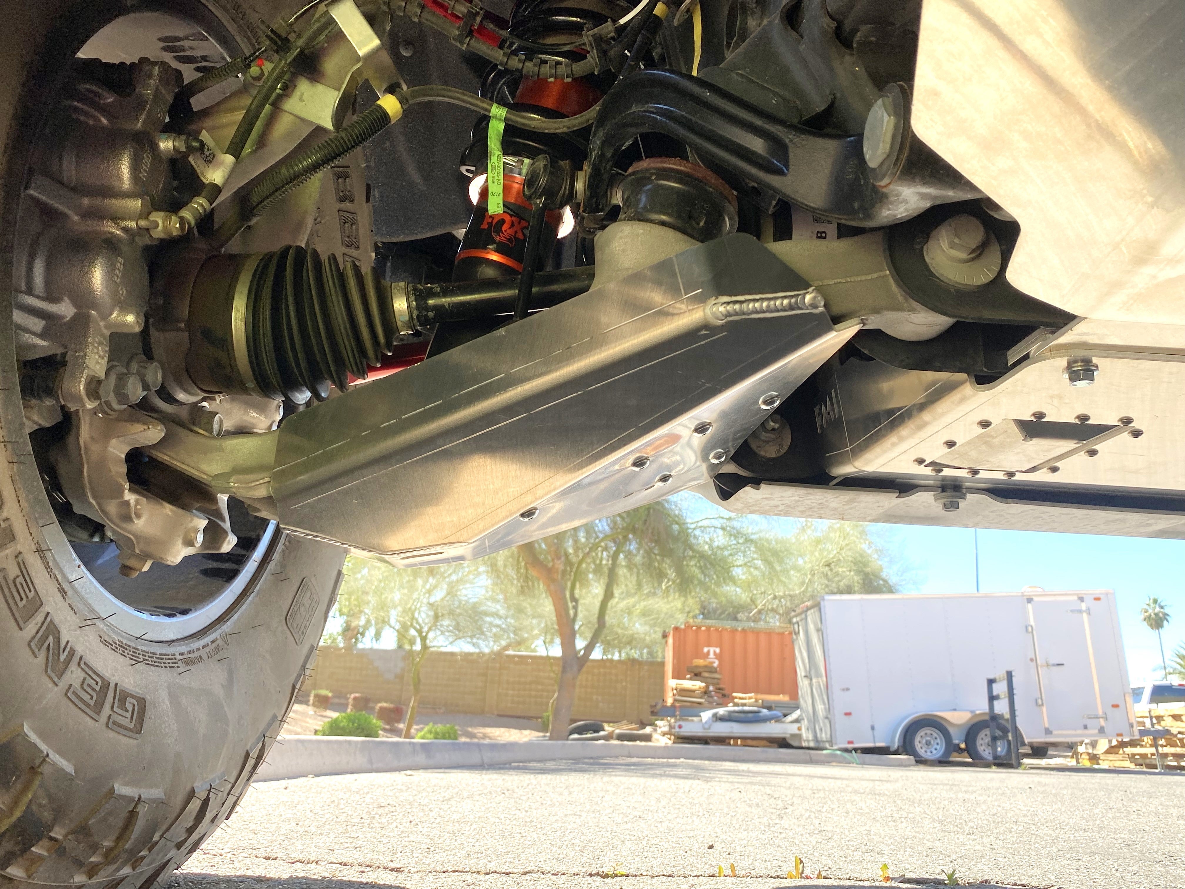 Bronco Raptor 2022 lower control arm skid plate kit installed, showcasing durable protection for offroad performance.