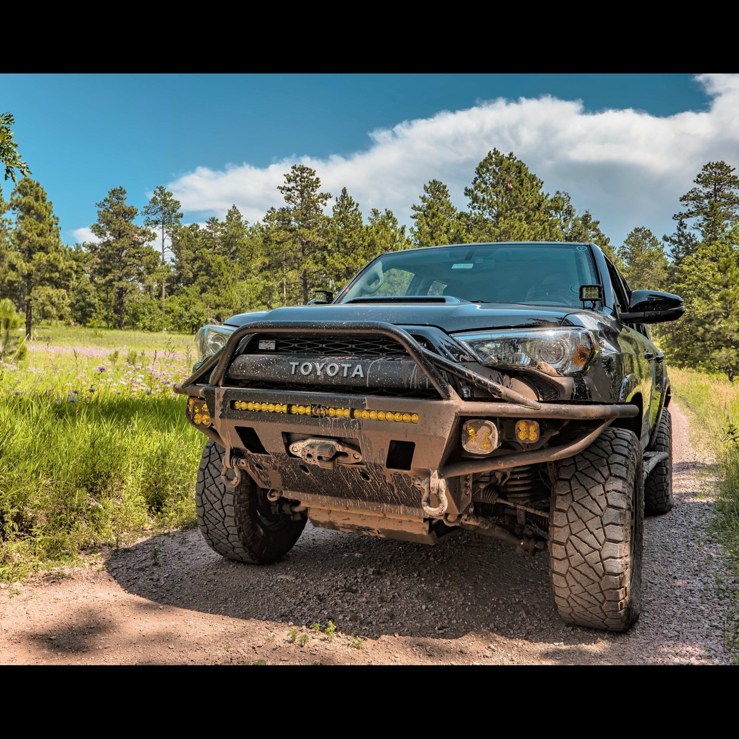 4Runner Hybrid Front Bumper for 5th Gen (2014-2024) installed on a rugged Toyota 4Runner in a natural outdoor setting.