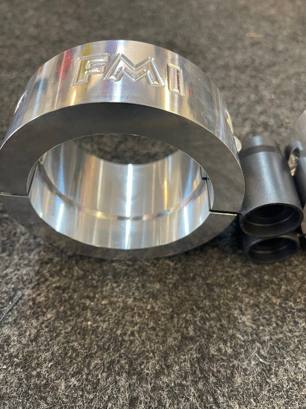 2025 Ram RHO 2.5 inch front leveling kit featuring a polished aluminum spacer and installation components.