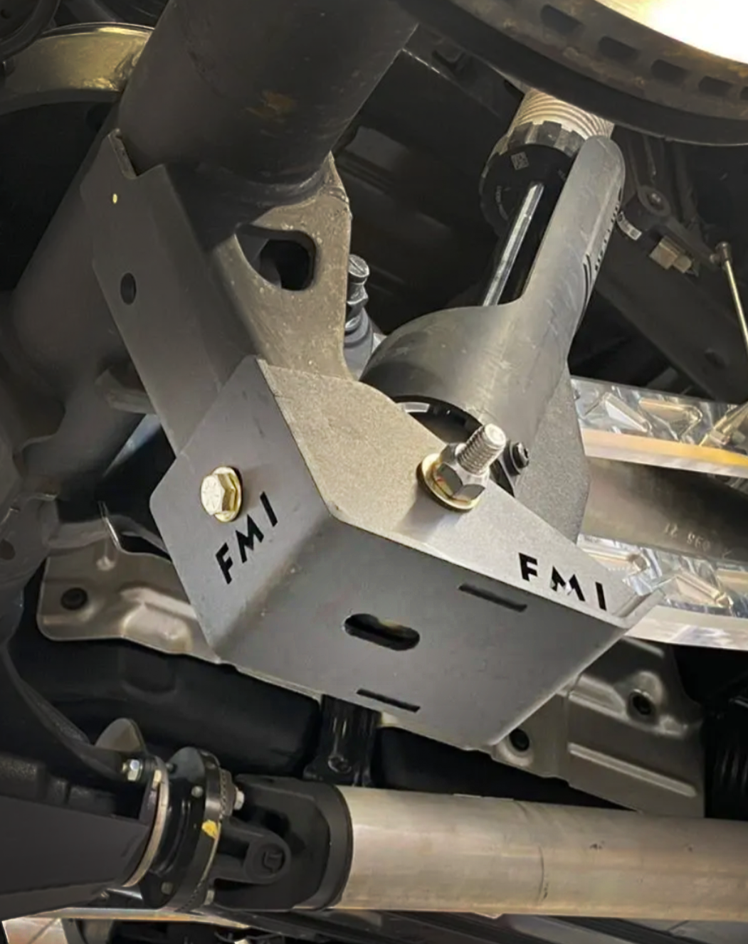2025 Ram RHO Rear Shock Skid Kit mounted under a truck, designed for enhanced protection and durability during off-road use.