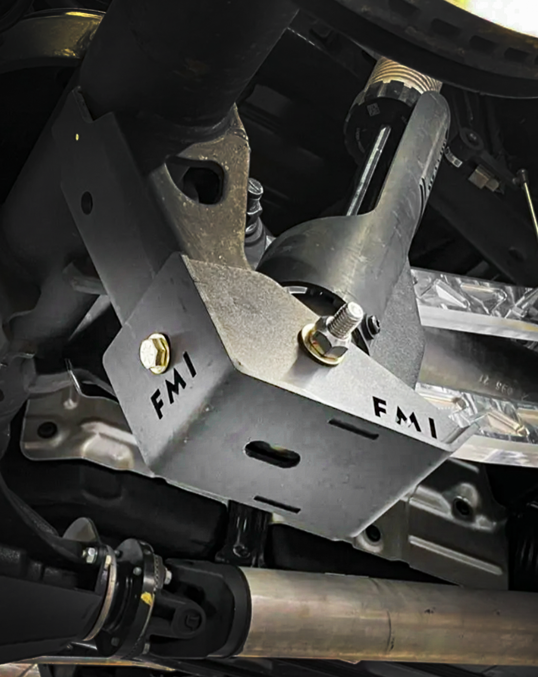 2025 Ram RHO Rear Shock Skid Kit showcasing durable metal construction and secure mounting for offroad protection.