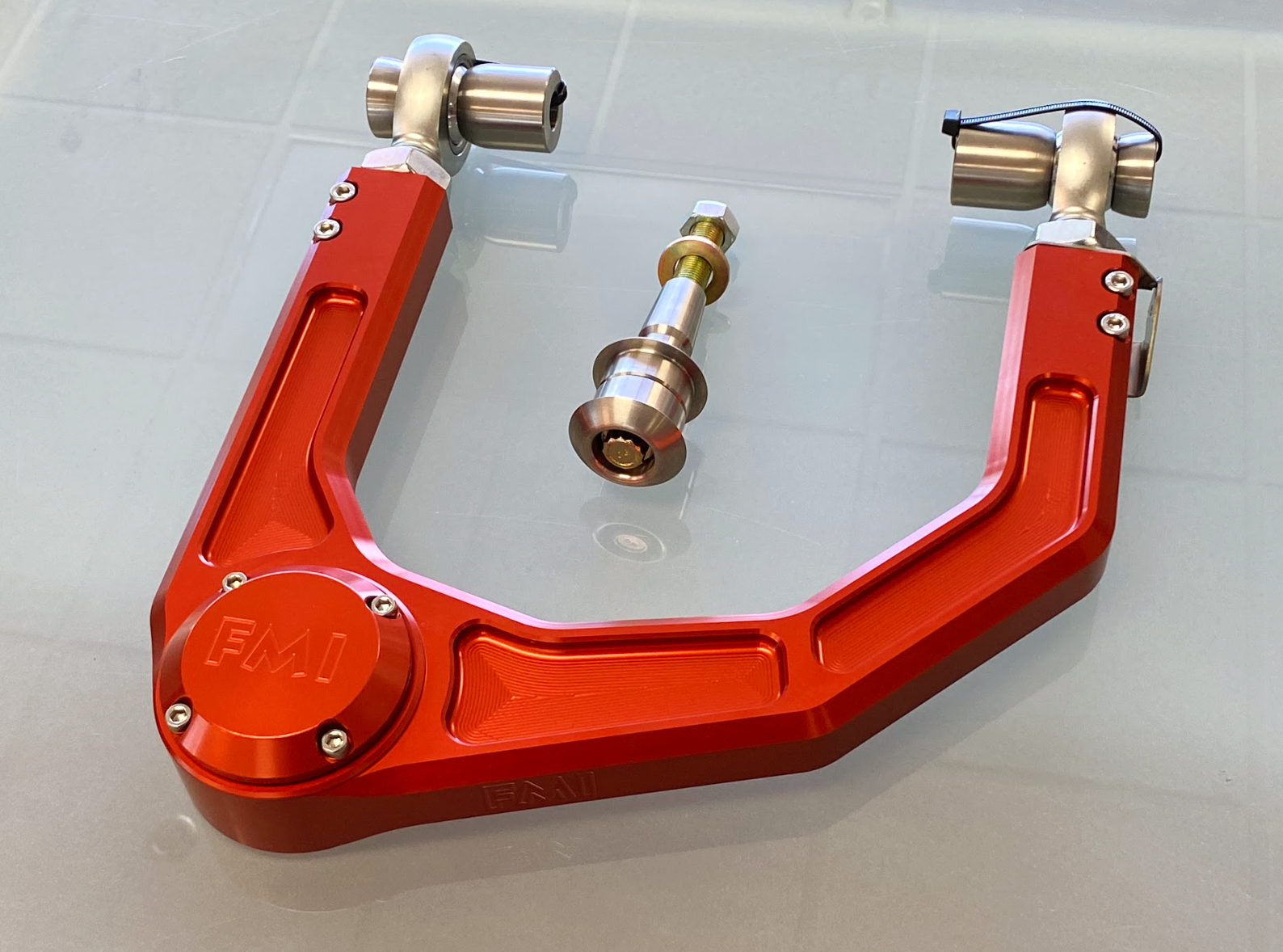 2024 Ranger Raptor billet upper control arm kit in red, featuring stock length design and high-quality components.