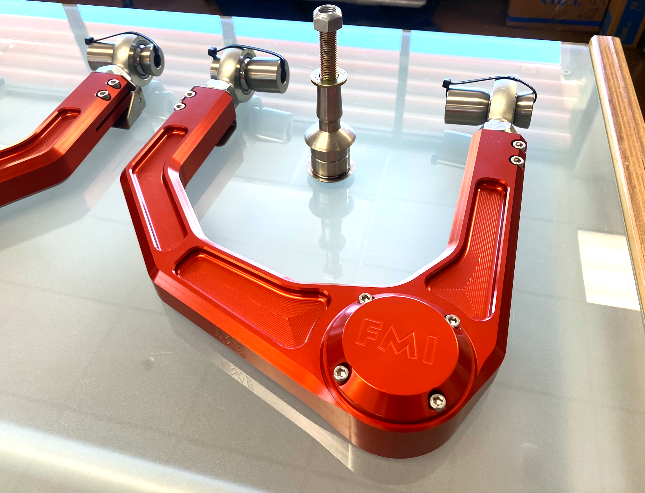 2024 Ranger Raptor billet upper control arm kit in red, designed for stock length, showcasing durable construction and precision engineering.