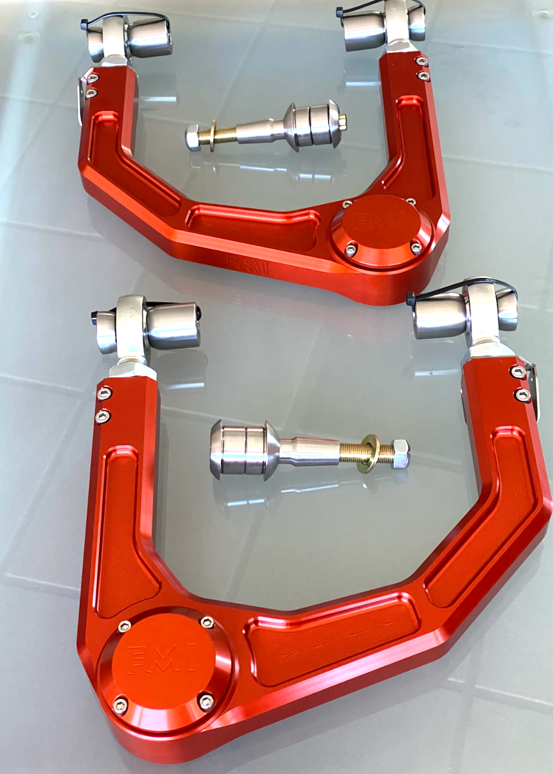 2024 Ranger Raptor billet upper control arm kit in red, featuring stock length and precision-engineered components.
