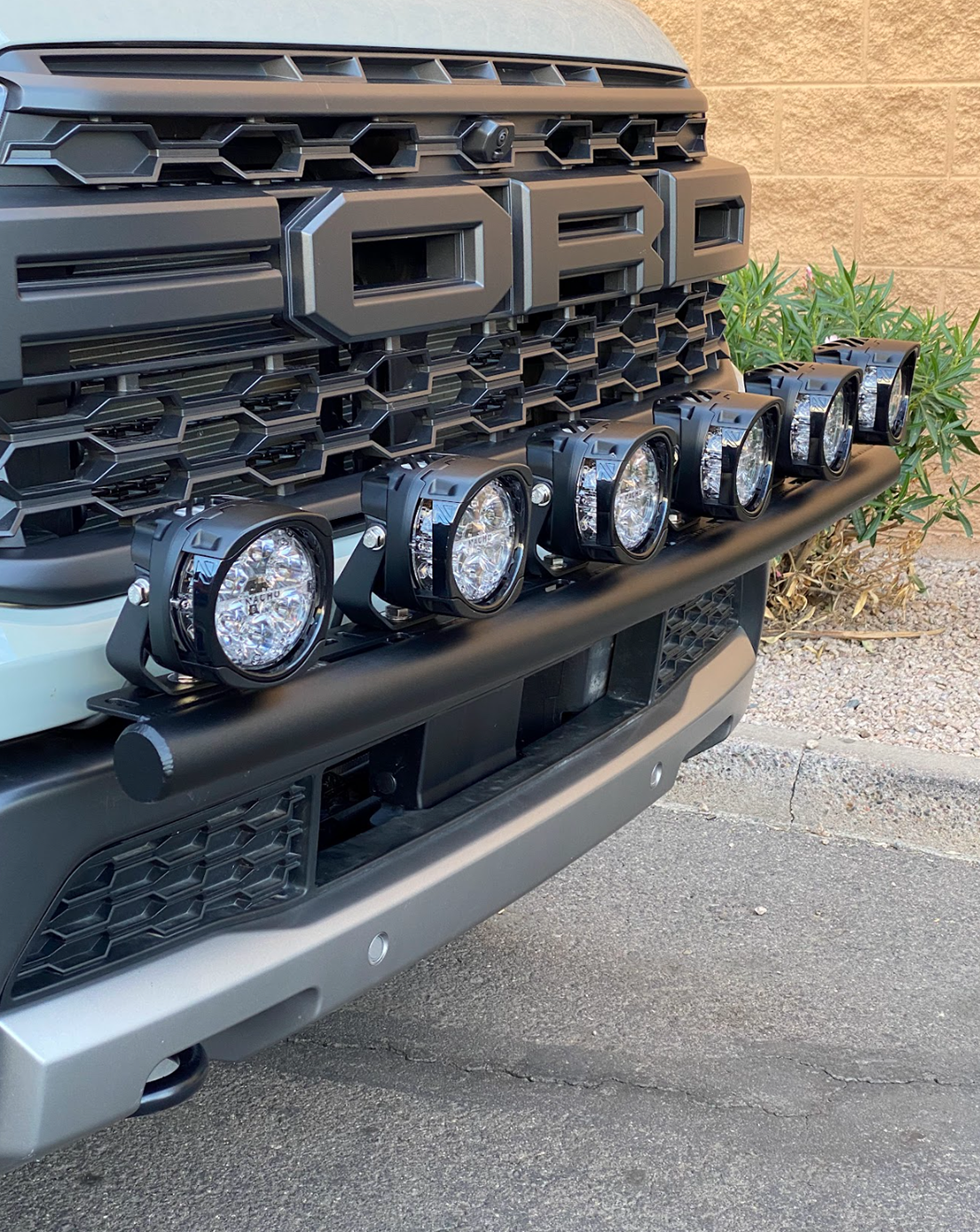 2024 Ranger Raptor Front Light Mount Kit installed on stock bumper, featuring multiple high-intensity lights for offroad visibility.