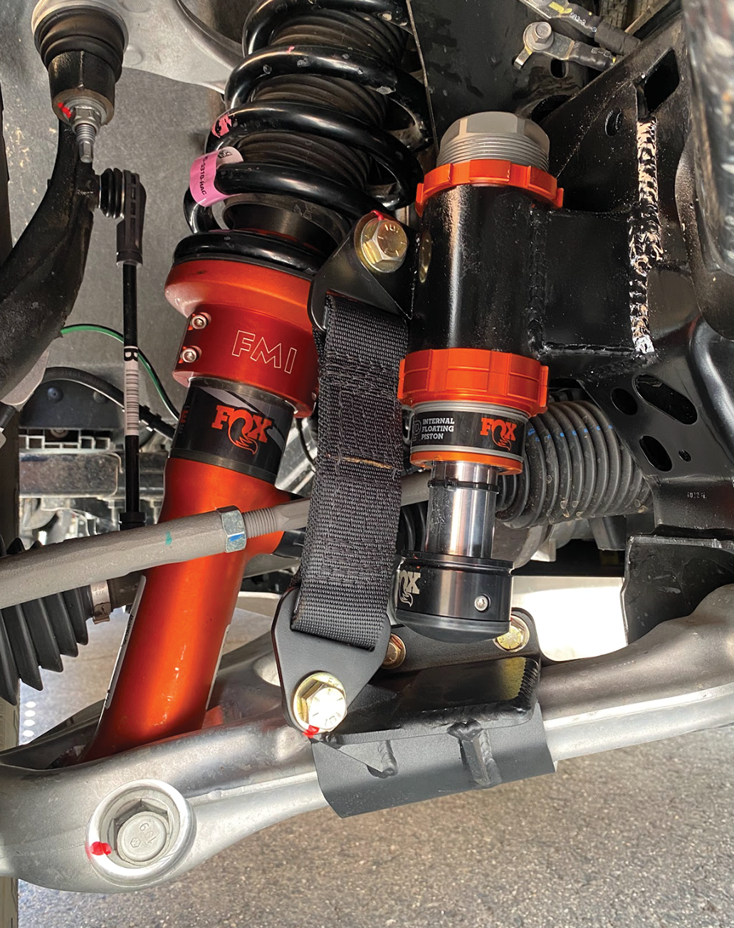 Front limit strap kit and bump stop for 2024 Ranger Raptor's stock lower arm, enhancing off-road performance and suspension stability.