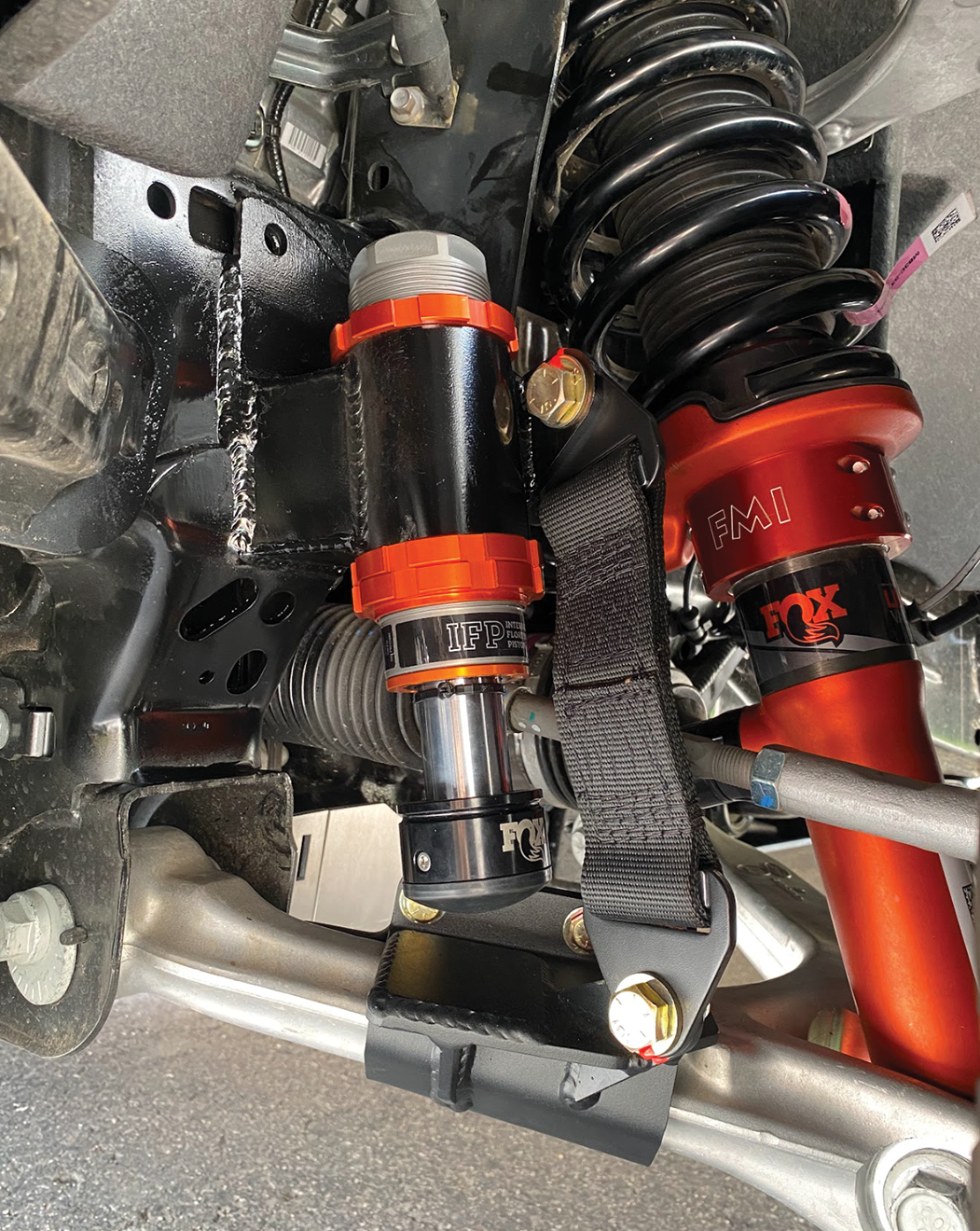 2024 Ranger Raptor front limit strap kit and bump stop installed on stock lower arm for enhanced offroad performance.