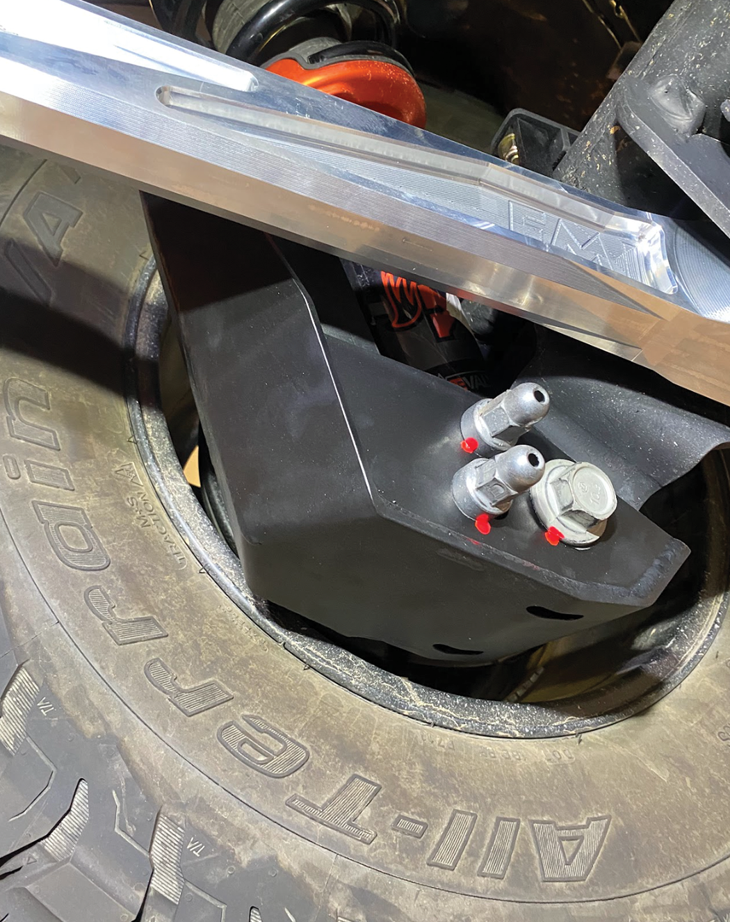 2024 Ranger Raptor rear shock skid kit installed, showcasing durable protection and precise fit around the shock assembly.