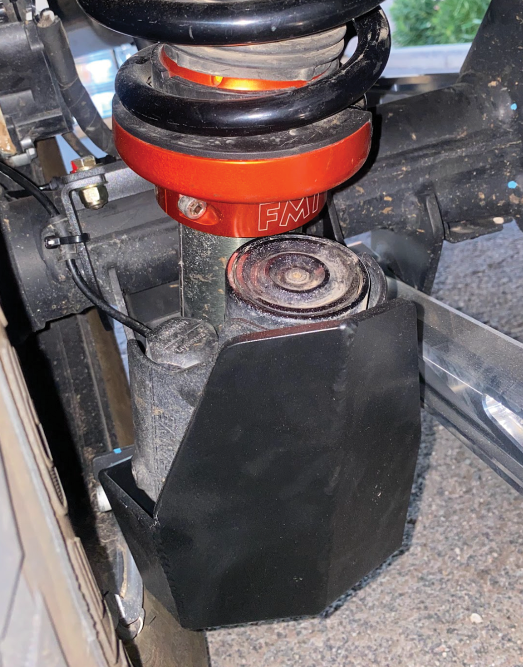 2024 Ranger Raptor rear shock skid kit installed, showcasing durable protection for off-road performance.