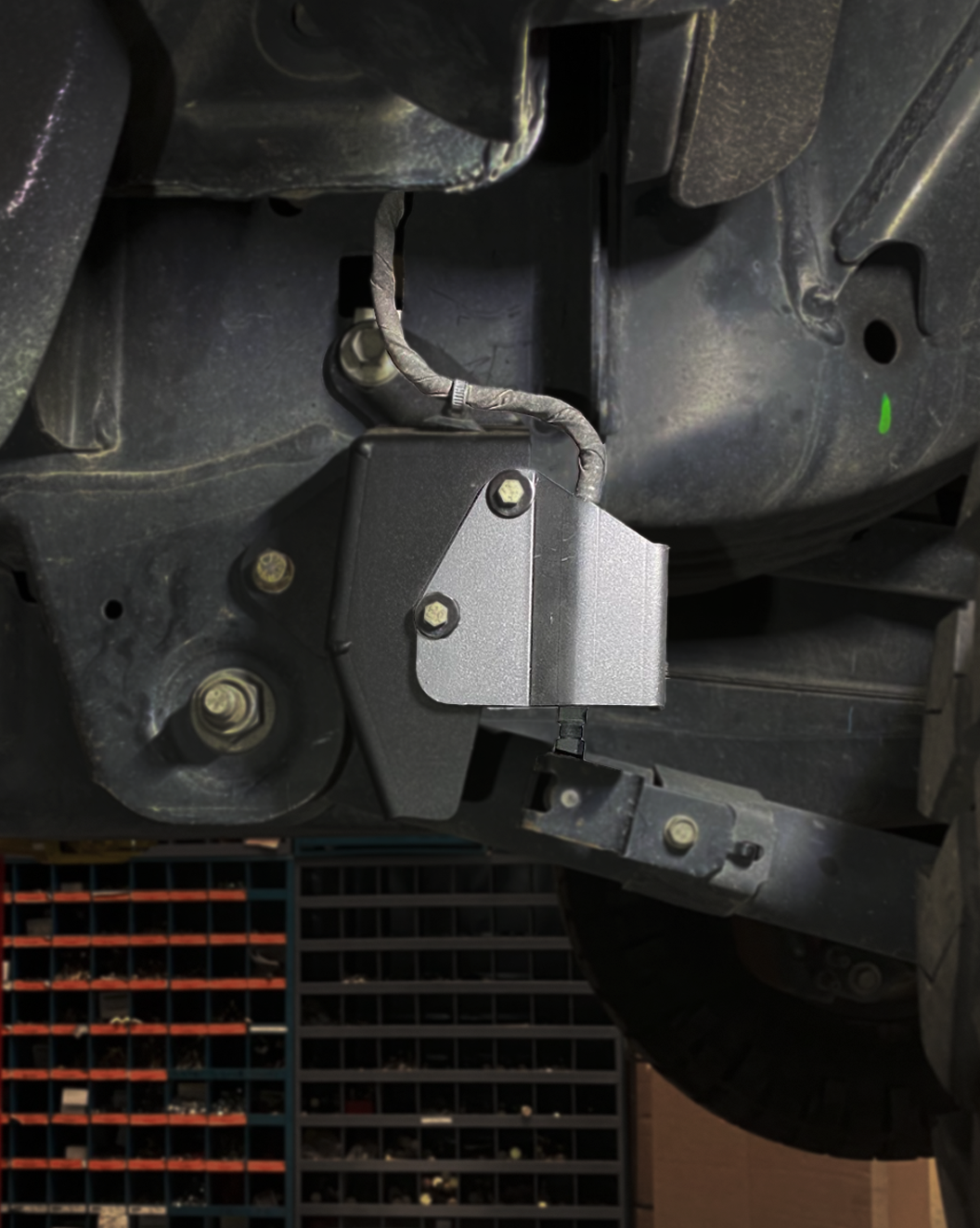 Rear suspension travel sensor wire protector for 2024+ Ranger Raptor, designed for enhanced durability and protection.