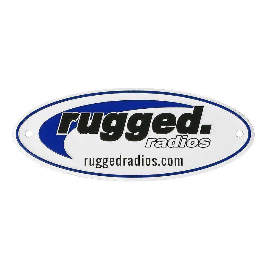 Metal Rugged Radios embossed badge featuring a blue and black design with the text "rugged. radios" and website URL.
