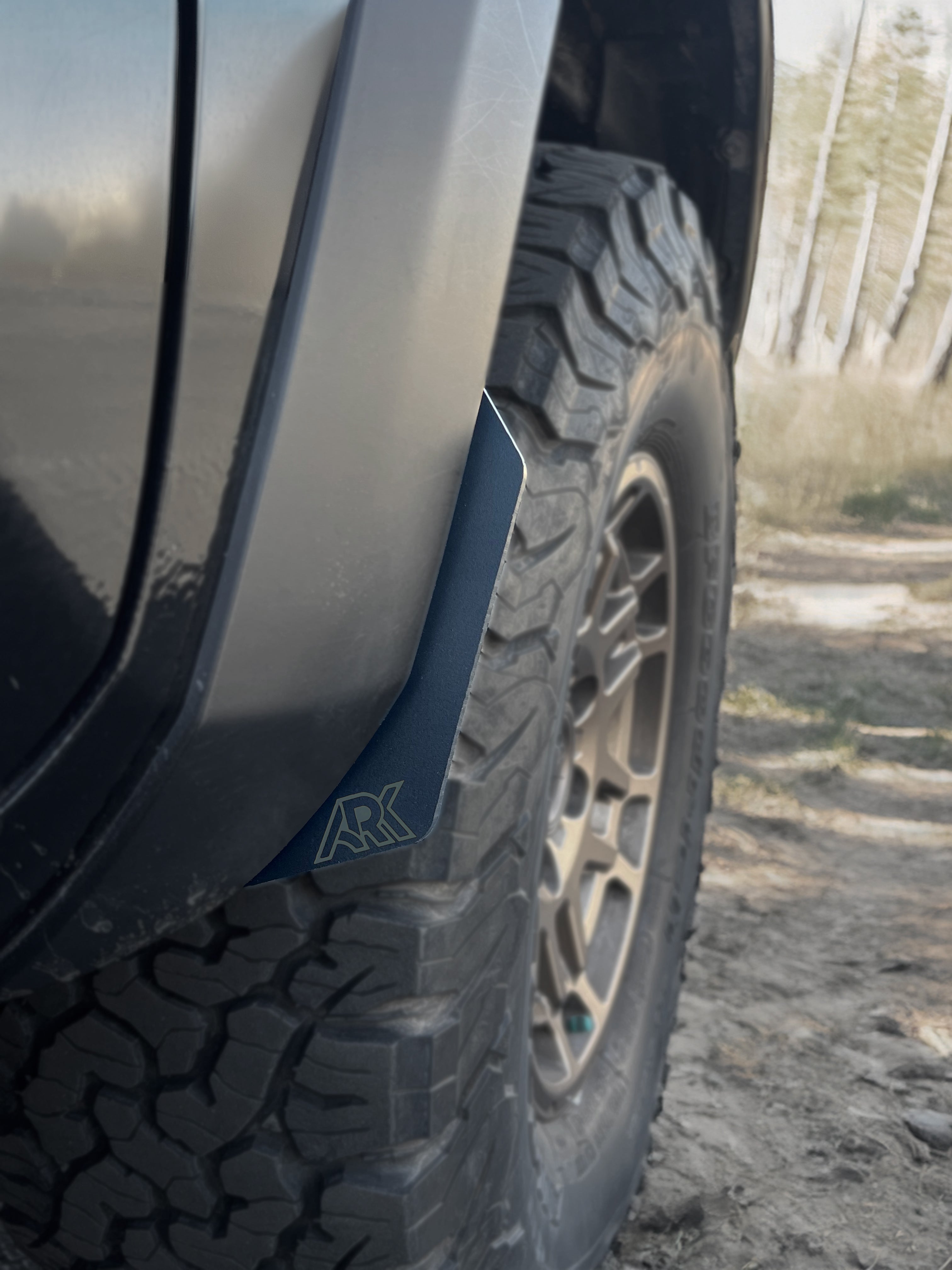 2016-2023 Toyota Tacoma TriXpoly Micro Flares installed on a tire, enhancing off-road style and protection.