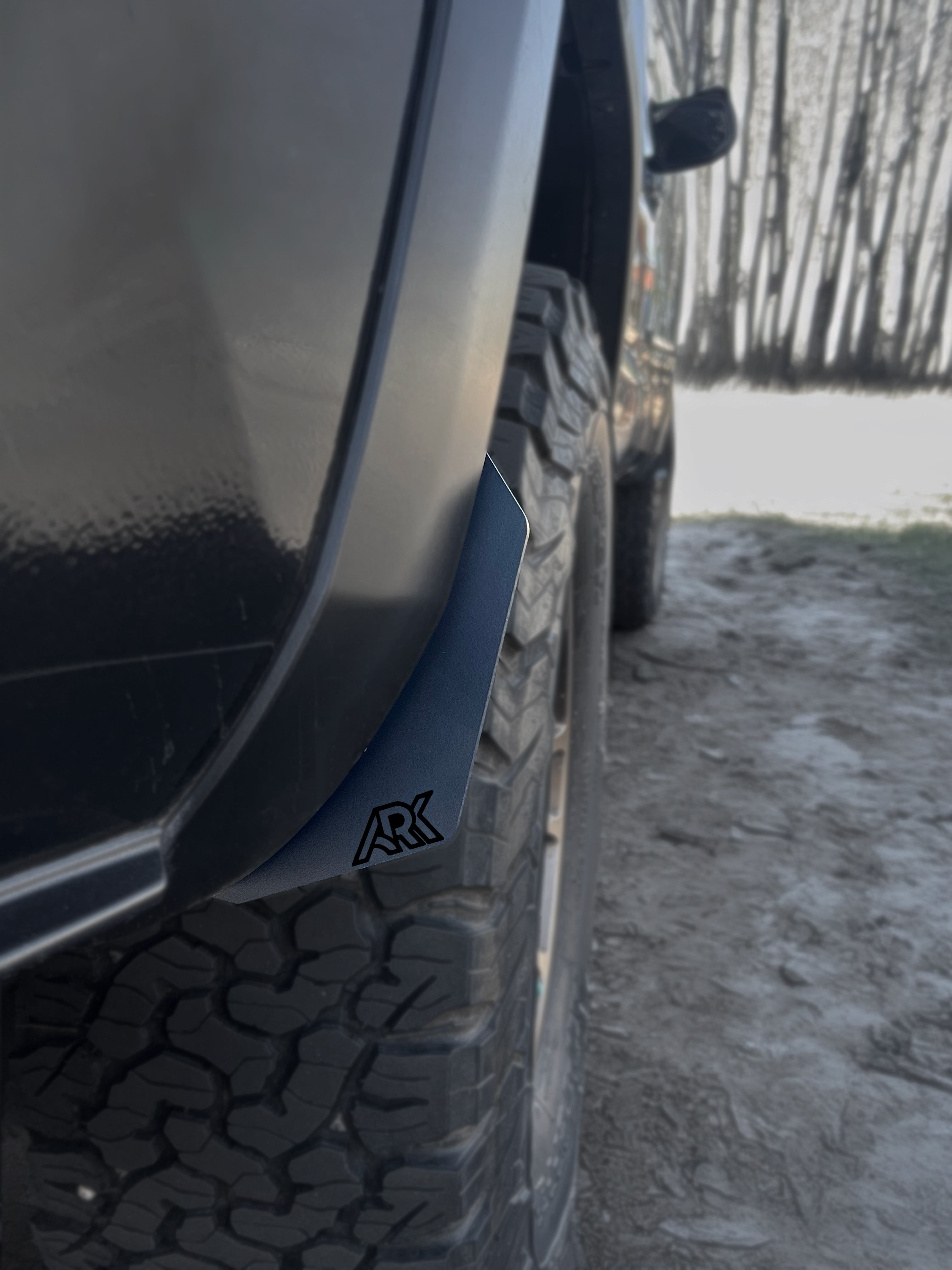TriXpoly splash guards and mudflaps for 2016-2023 Toyota Tacoma, designed for durability and protection against mud and debris.