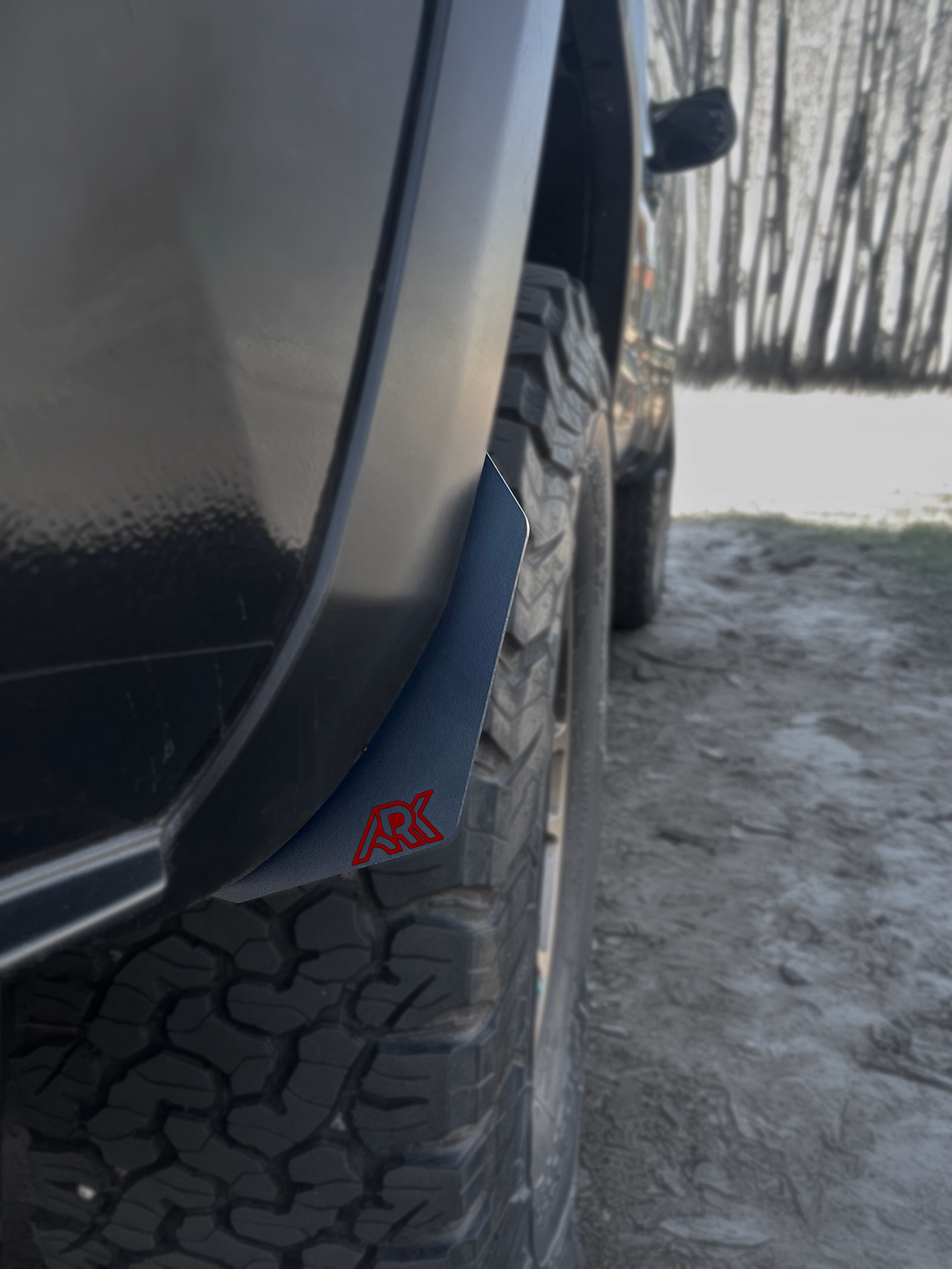TriXpoly splash guards and mudflaps for 2016-2023 Toyota Tacoma, designed for protection and durability on off-road adventures.
