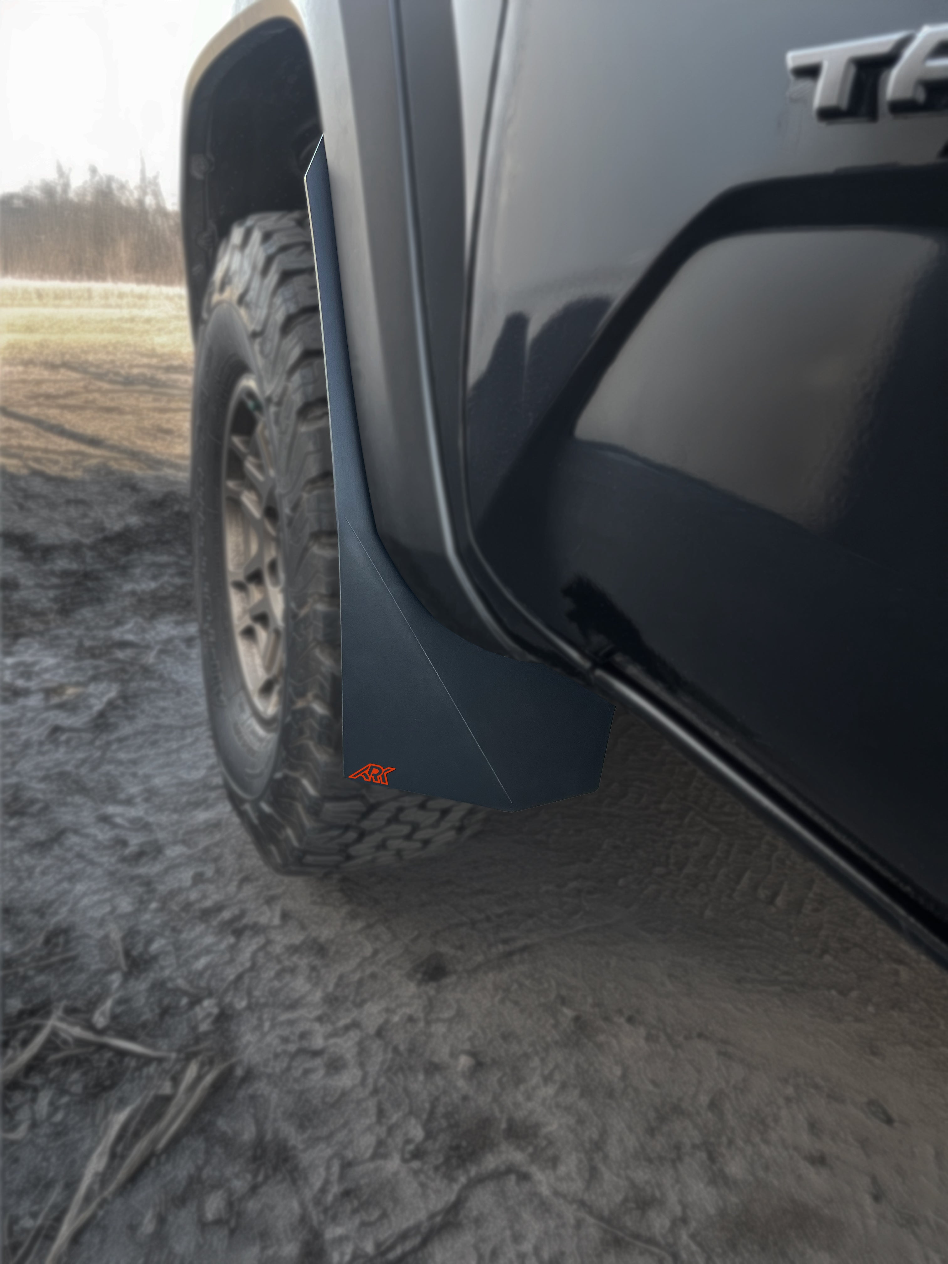 Durable TriXpoly mudflaps for 2016-2023 Toyota Tacoma, designed for off-road protection and style.