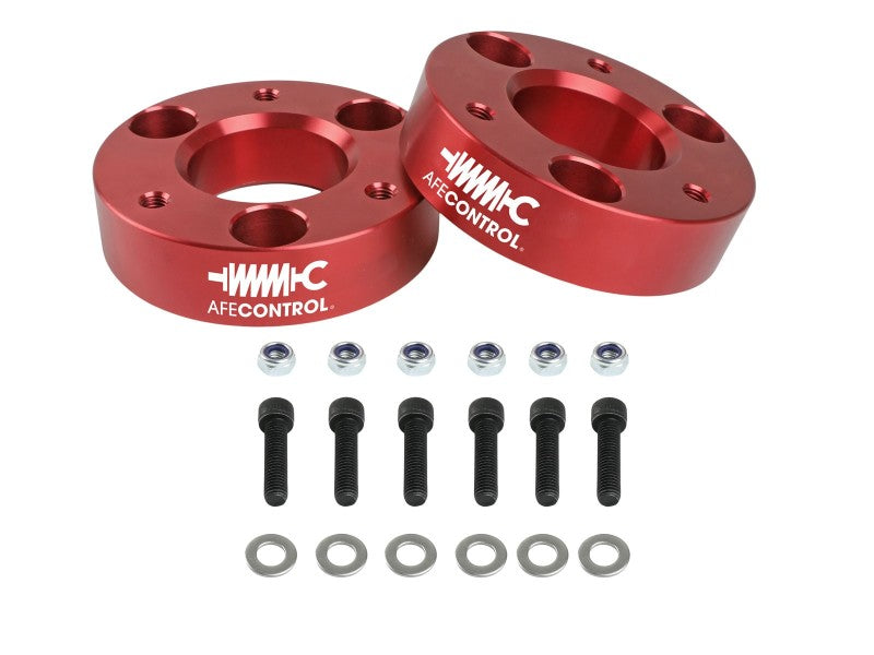 aFe CONTROL 3.0 IN Leveling Kit for 2021 RAM 1500 TRX featuring red spacers, bolts, and washers for enhanced vehicle height.