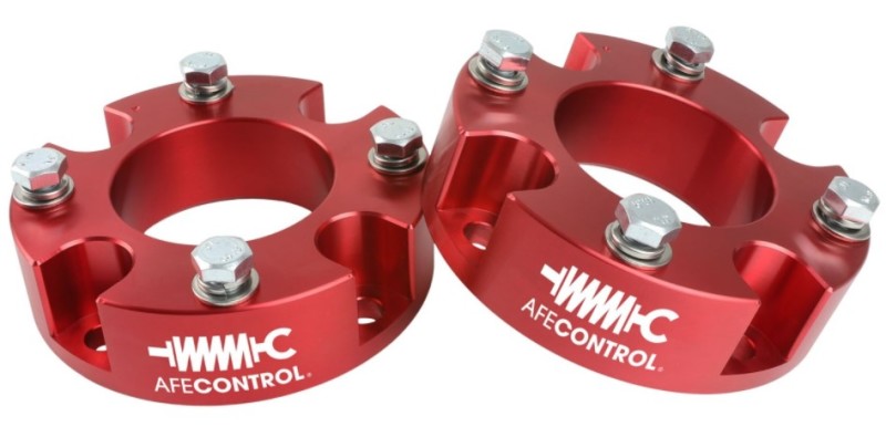 aFe CONTROL 2.0 IN Leveling Kit for 2007-2021 Toyota Tundra in red, featuring durable aluminum spacers and hardware.