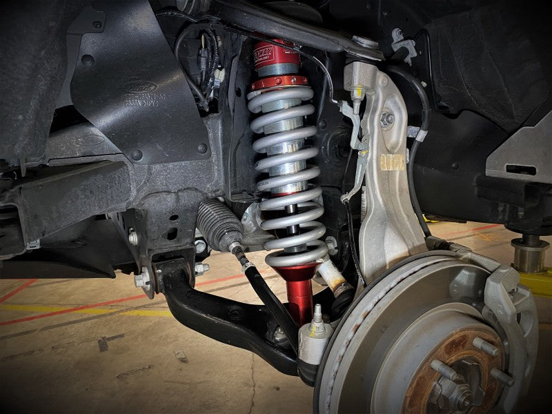 aFe Sway-A-Way 2.5in Front Coil Over Kit installed on a 2019-2021 Ford Ranger, showcasing suspension components and coil spring.
