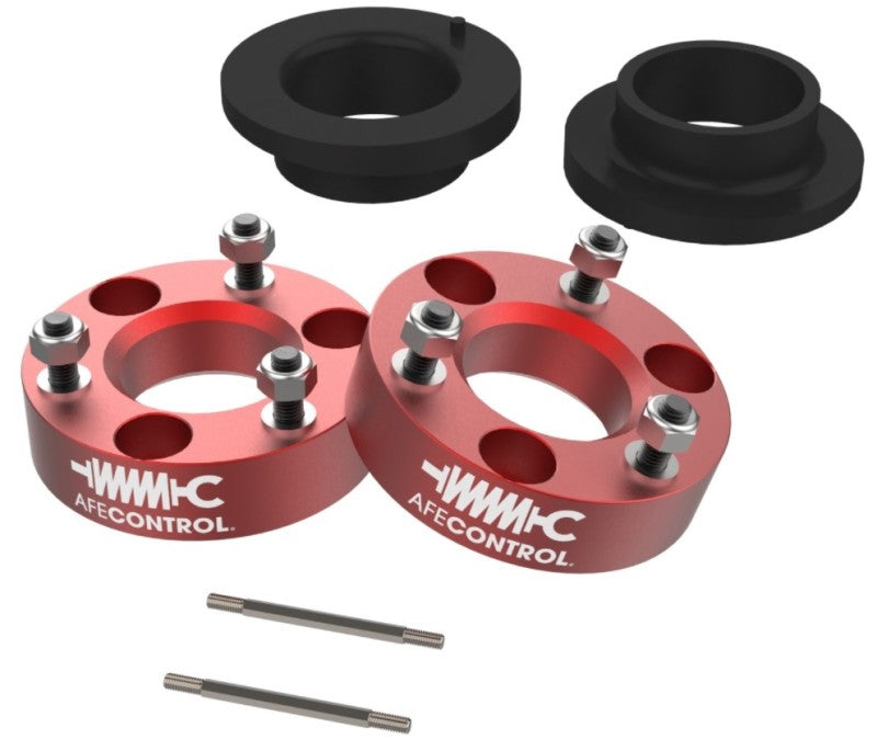 aFe CONTROL 3.0 IN Leveling Kit for 2021 RAM 1500 TRX, featuring red spacers and installation hardware for improved ride height.