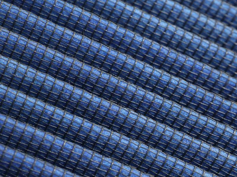 Close-up of aFe Magnum FLOW Pro 5R air filter, featuring blue synthetic media designed for 2021+ RAM 1500 TRX V8-6.2L.