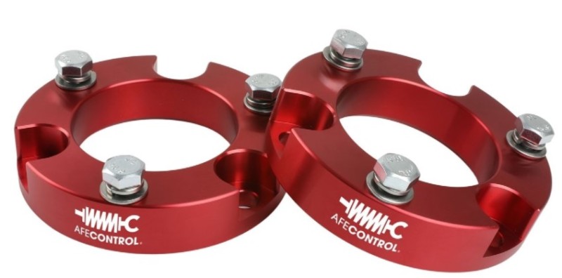 aFe CONTROL 2.0 IN Leveling Kit for 05-21 Toyota 4Runner, FJ Cruiser, Tacoma in red with bolts for easy installation.