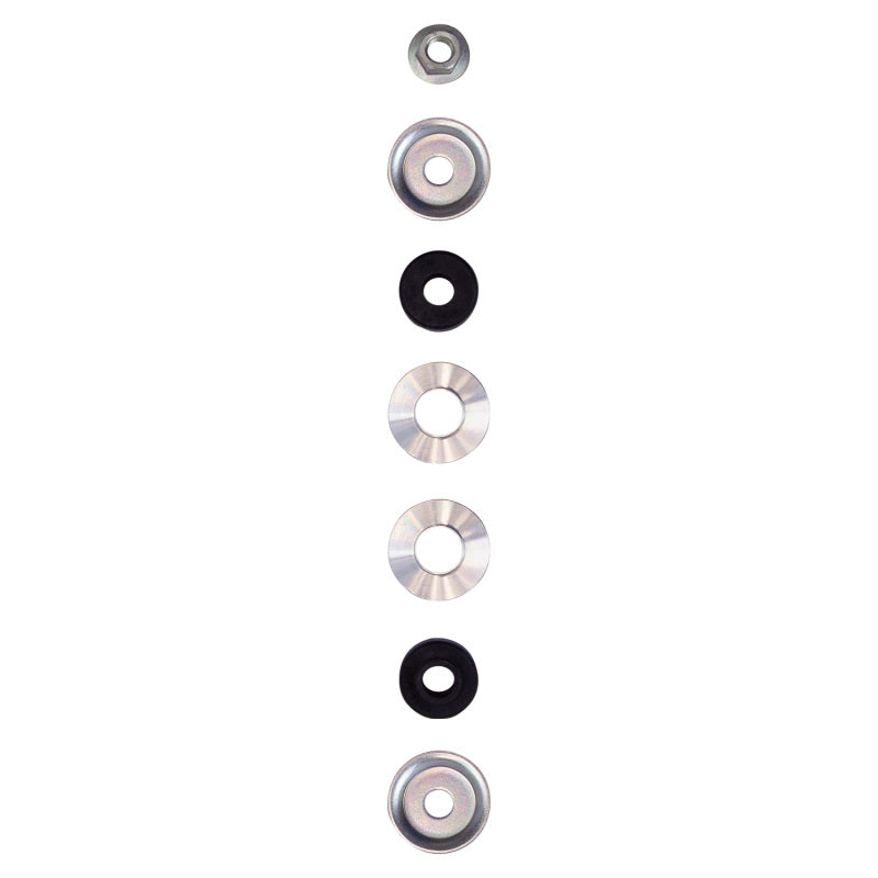 Bilstein 5100 Series rear shock absorber components for 2012 Toyota FJ Cruiser, featuring washers and bushings.
