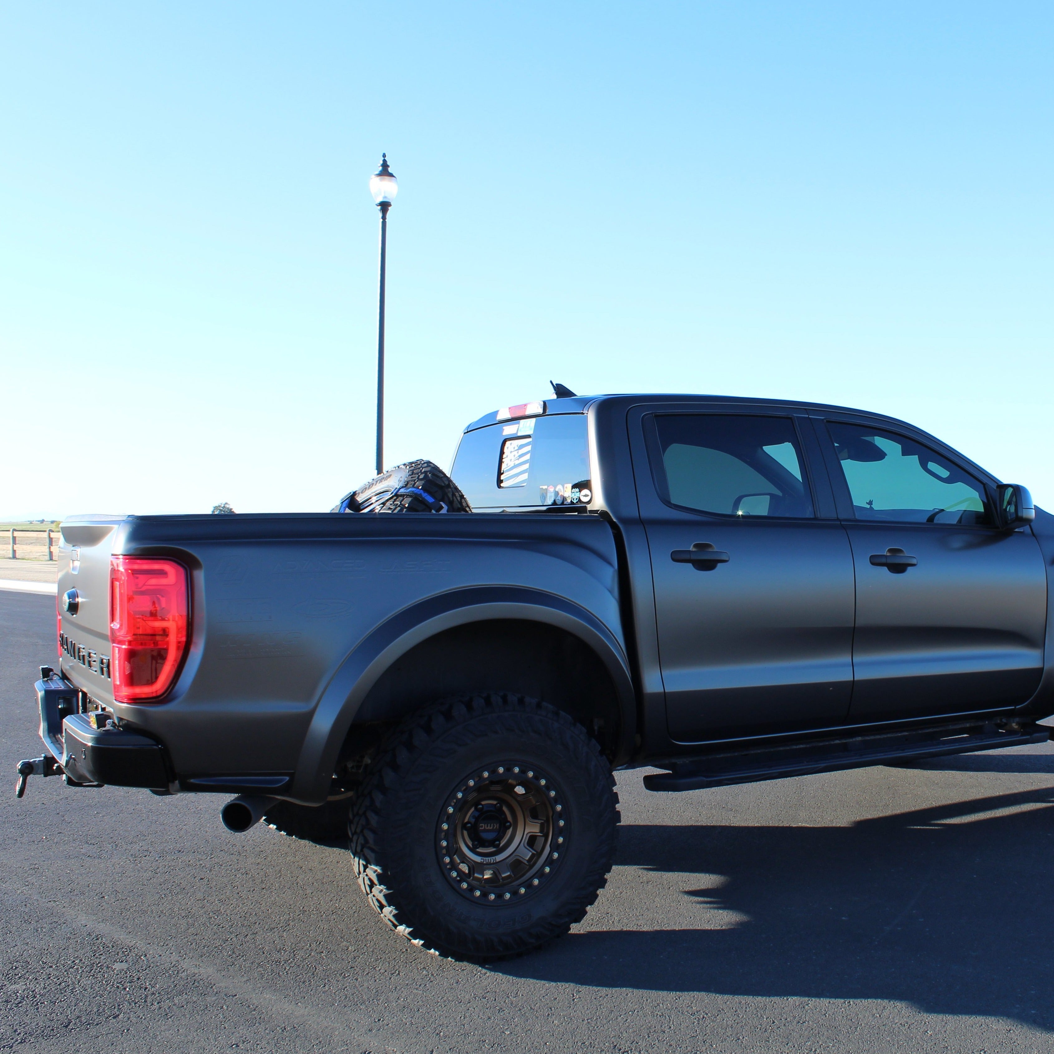 2019-2022 Ford Ranger with aftermarket bedsides, showcasing a rugged offroad design and enhanced tire clearance.