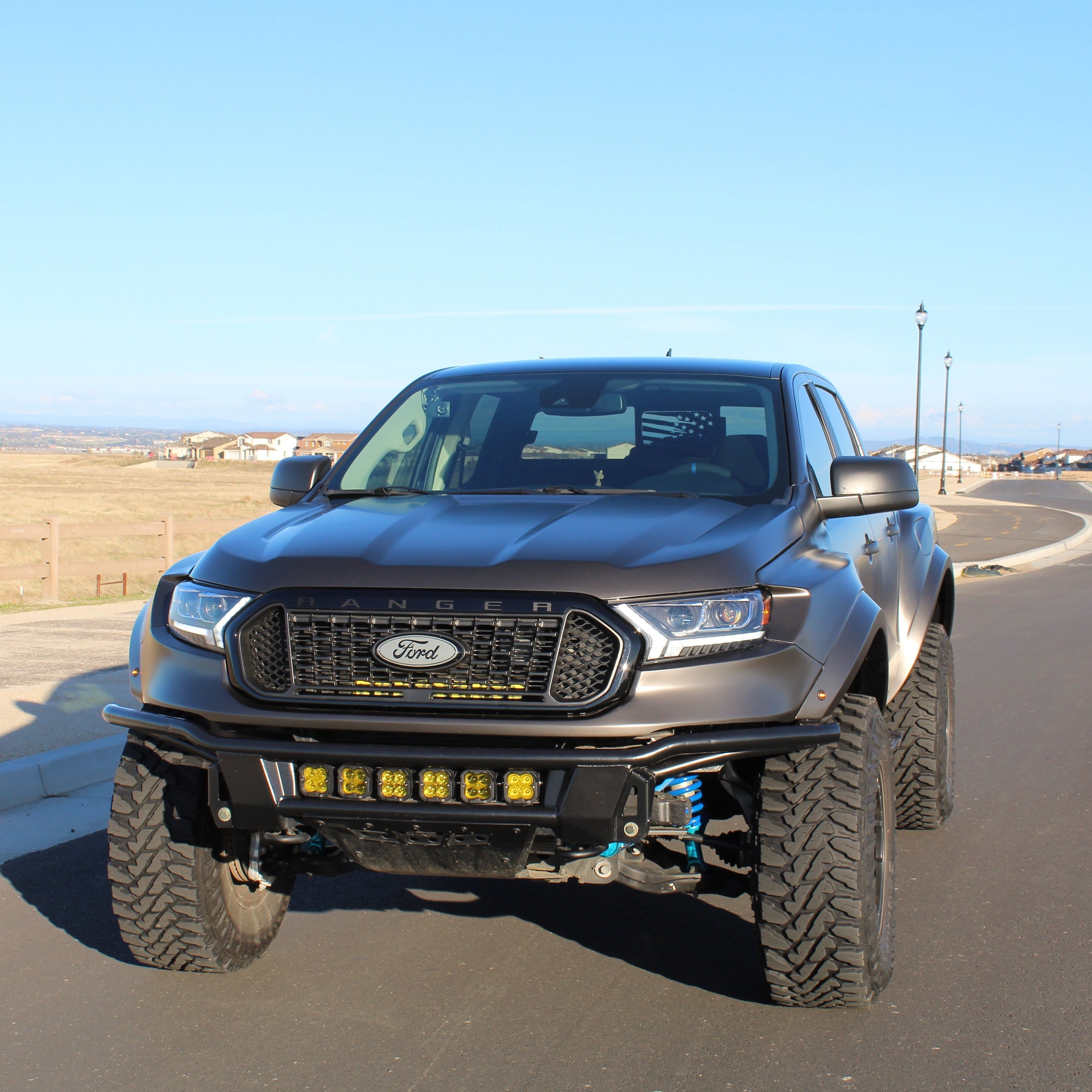 2019-2022 Ford Ranger with aftermarket fenders, showcasing a rugged offroad design and enhanced front lighting.