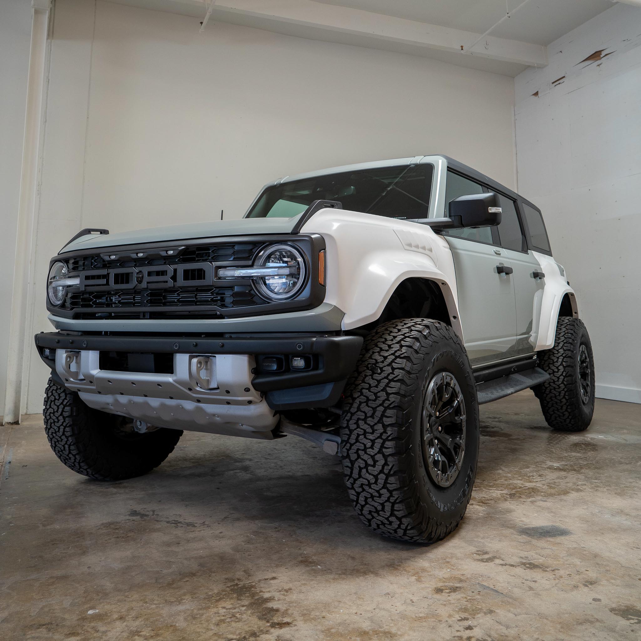 2022-2024 Ford Bronco Raptor with a rear quarter kit, showcasing rugged design and off-road capabilities.