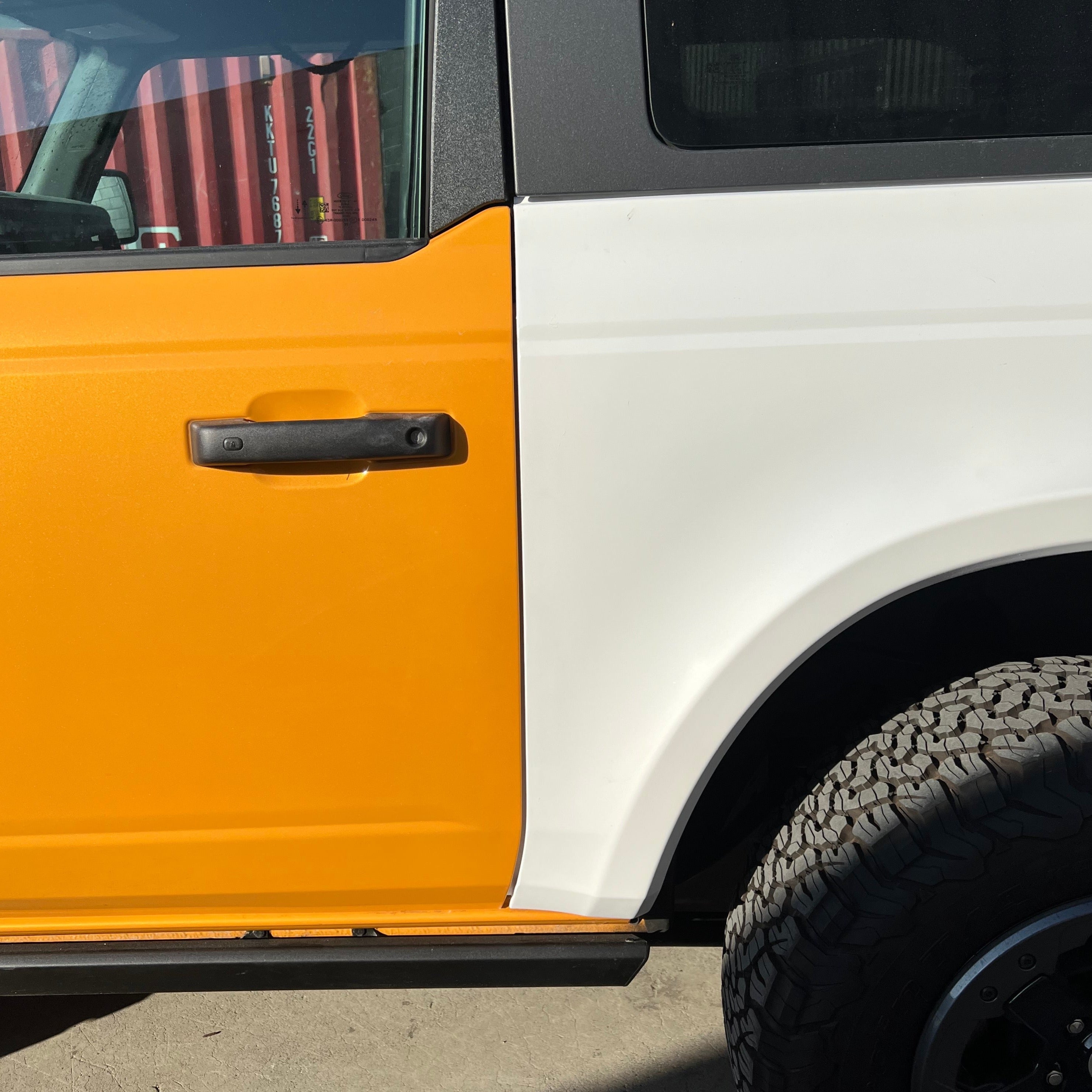 2021-2022 Ford Bronco 2-Door Rear Quarter Kit showcasing a vibrant orange and white color scheme.