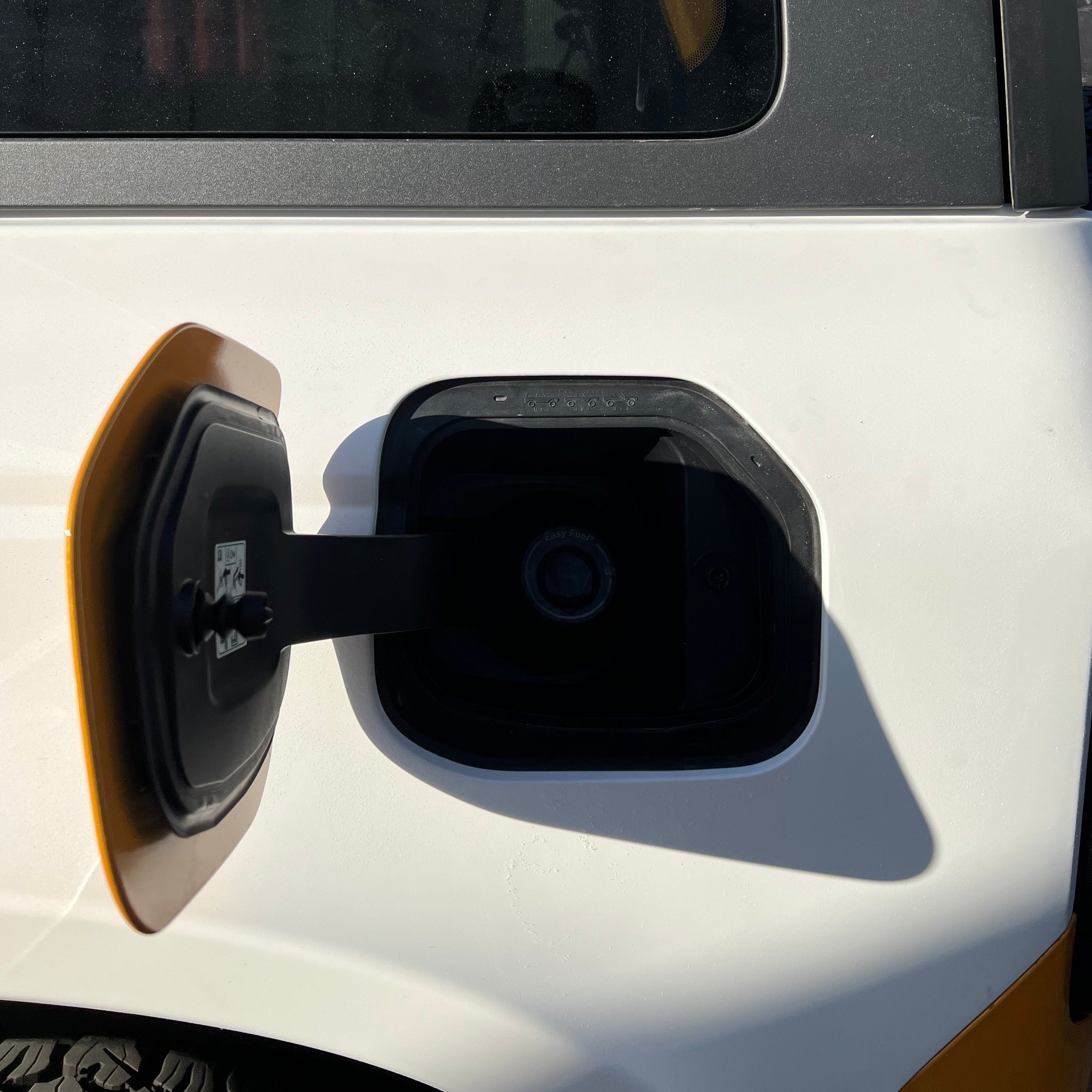 Close-up of the fuel filler area on a 2021-2022 Ford Bronco 2-Door, showcasing the rear quarter kit design.
