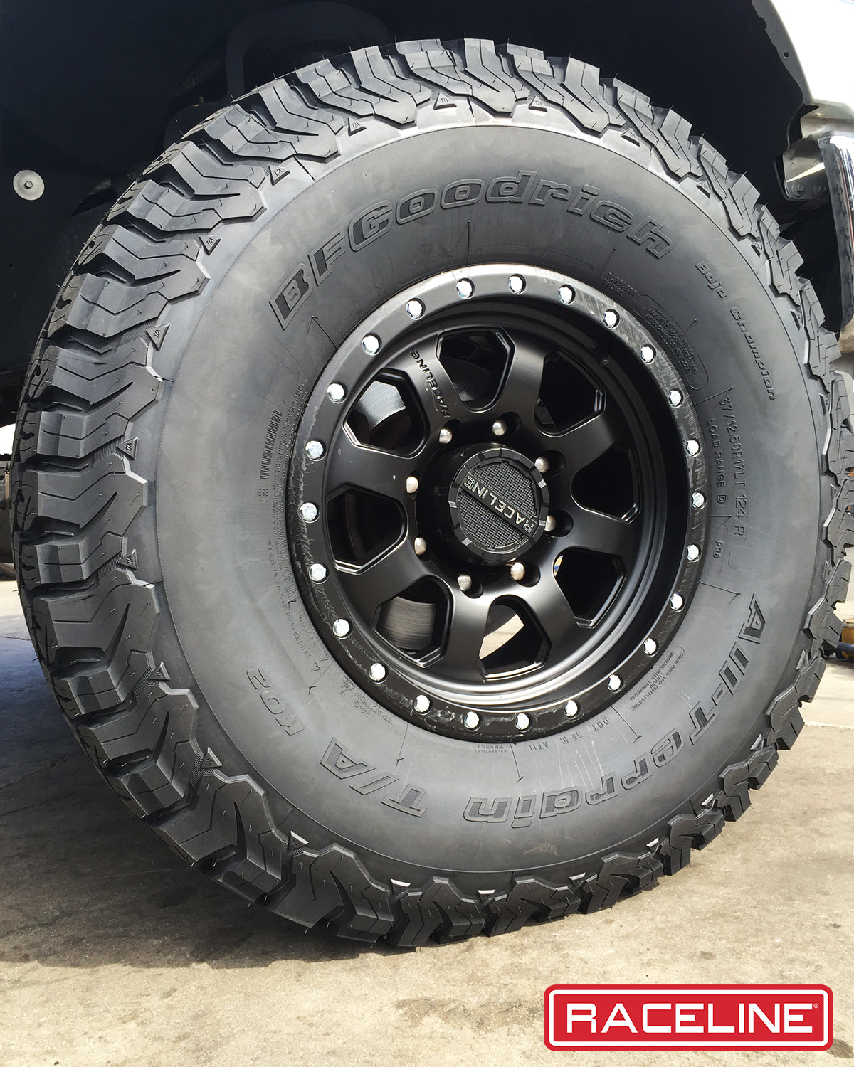Black Raceline 929B Avenger wheel mounted on a rugged tire, showcasing a durable off-road design for trucks and SUVs.