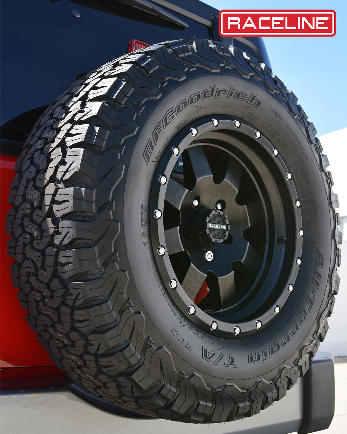 935B Defender tire mounted on a black wheel, showcasing rugged tread design for offroad performance.