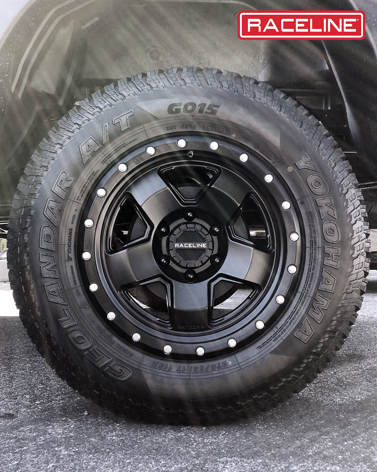 Black Raceline 937B Combat wheel mounted on a Yokohama Geolandar A/T tire, showcasing rugged off-road design and durability.
