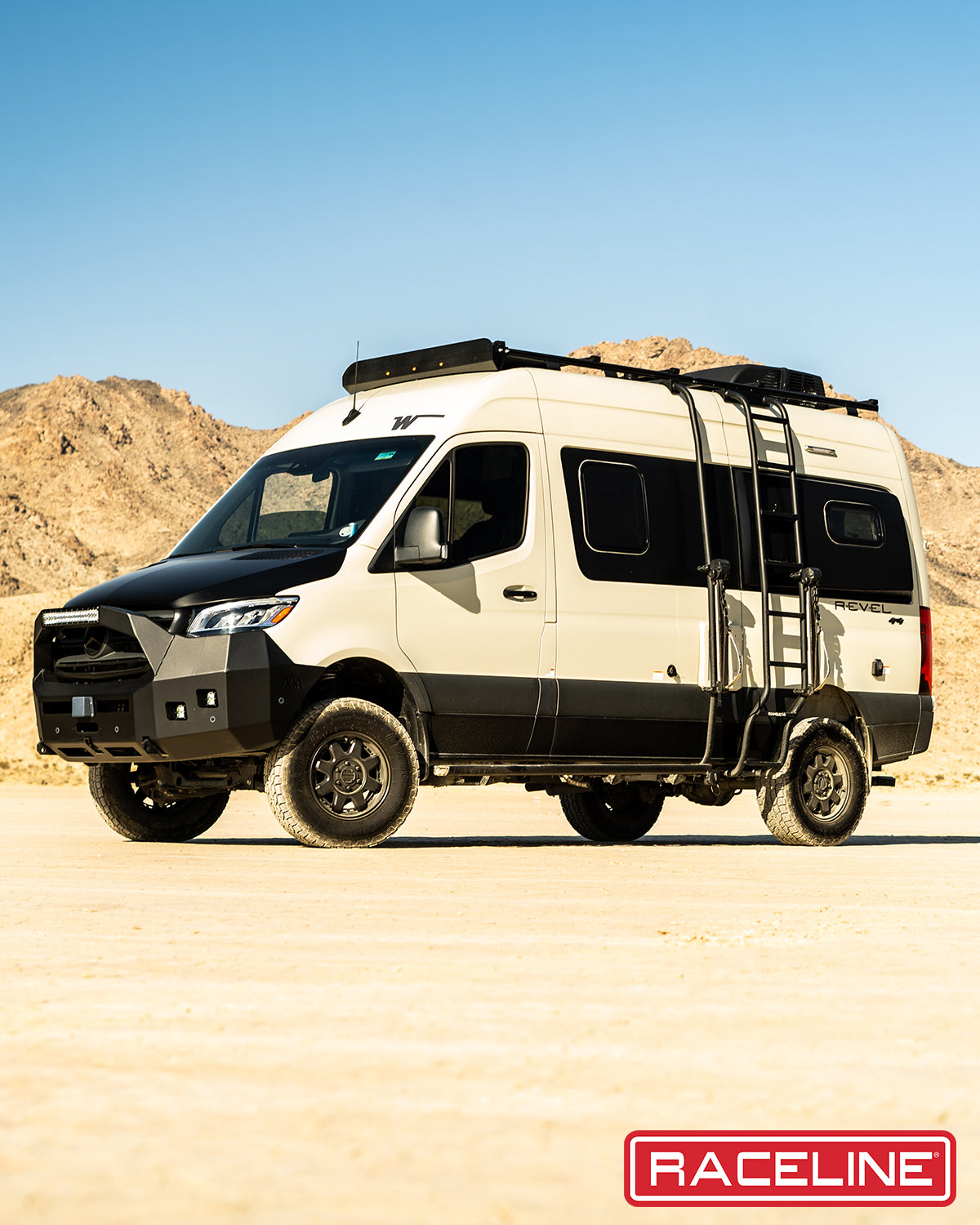947B Scout Van in a desert landscape, featuring rugged tires, a roof rack, and a sleek design for offroad adventures.