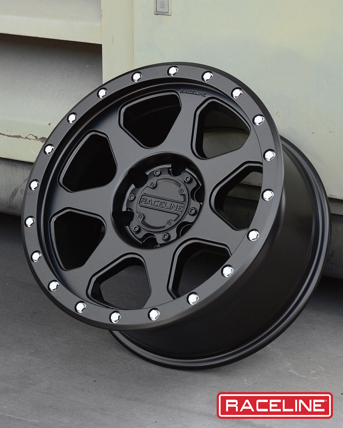 Black Raceline 949B 7X wheel with a rugged design and polished accents, ideal for offroad vehicles and customization.