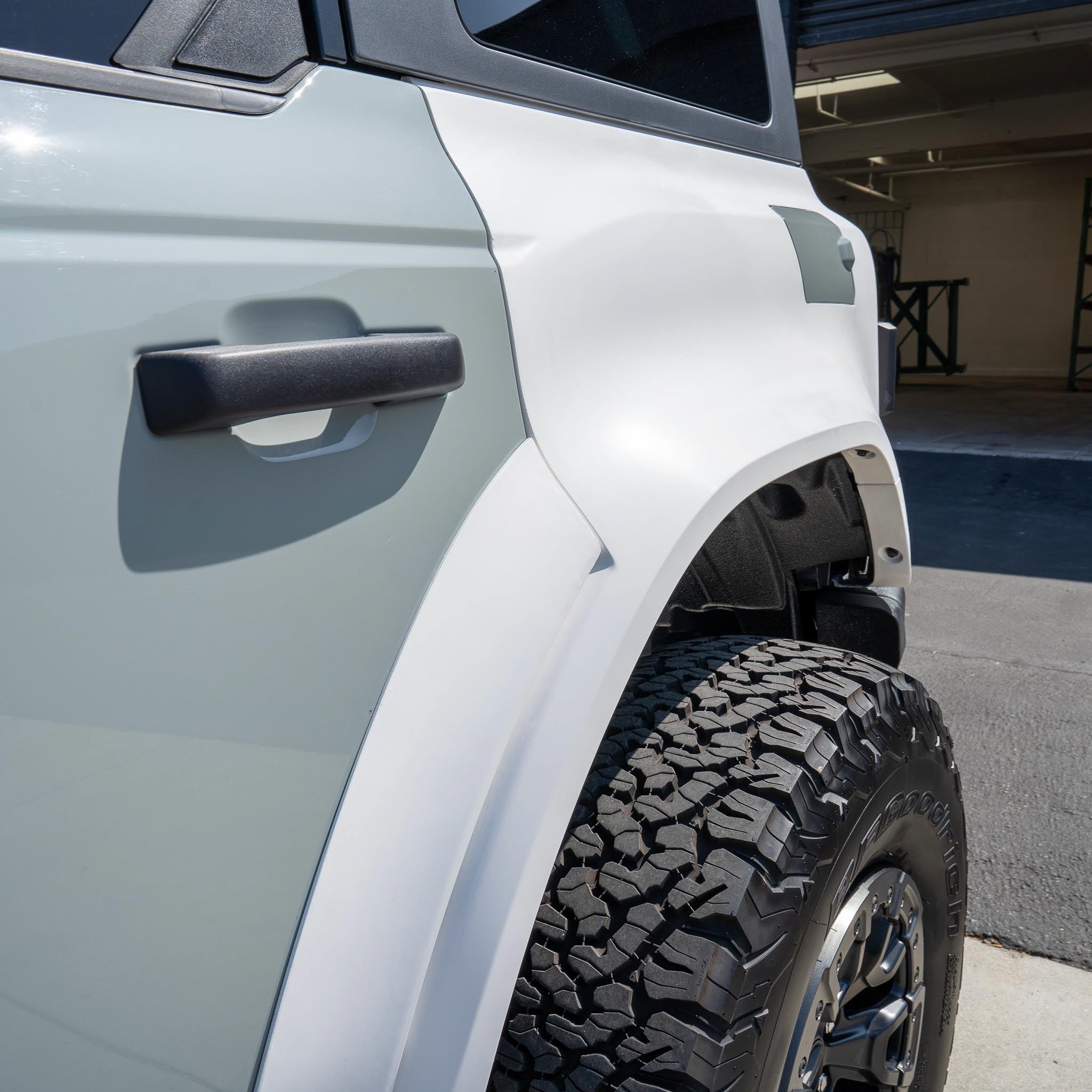 2022-2024 Ford Bronco Raptor rear quarter kit showcasing a rugged design and durable tire clearance. Ideal for off-road enthusiasts.