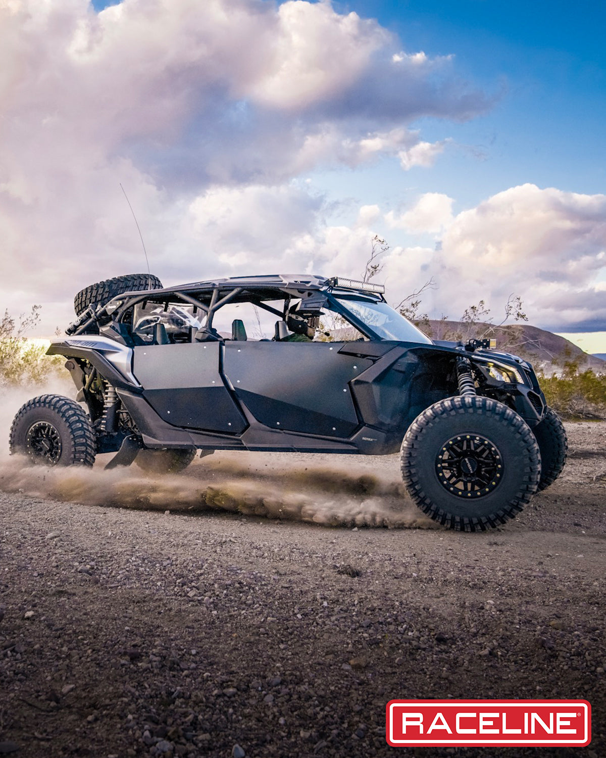 A91G Ryno Beadlock wheel mounted on an off-road vehicle driving through rugged terrain, showcasing durability and performance.